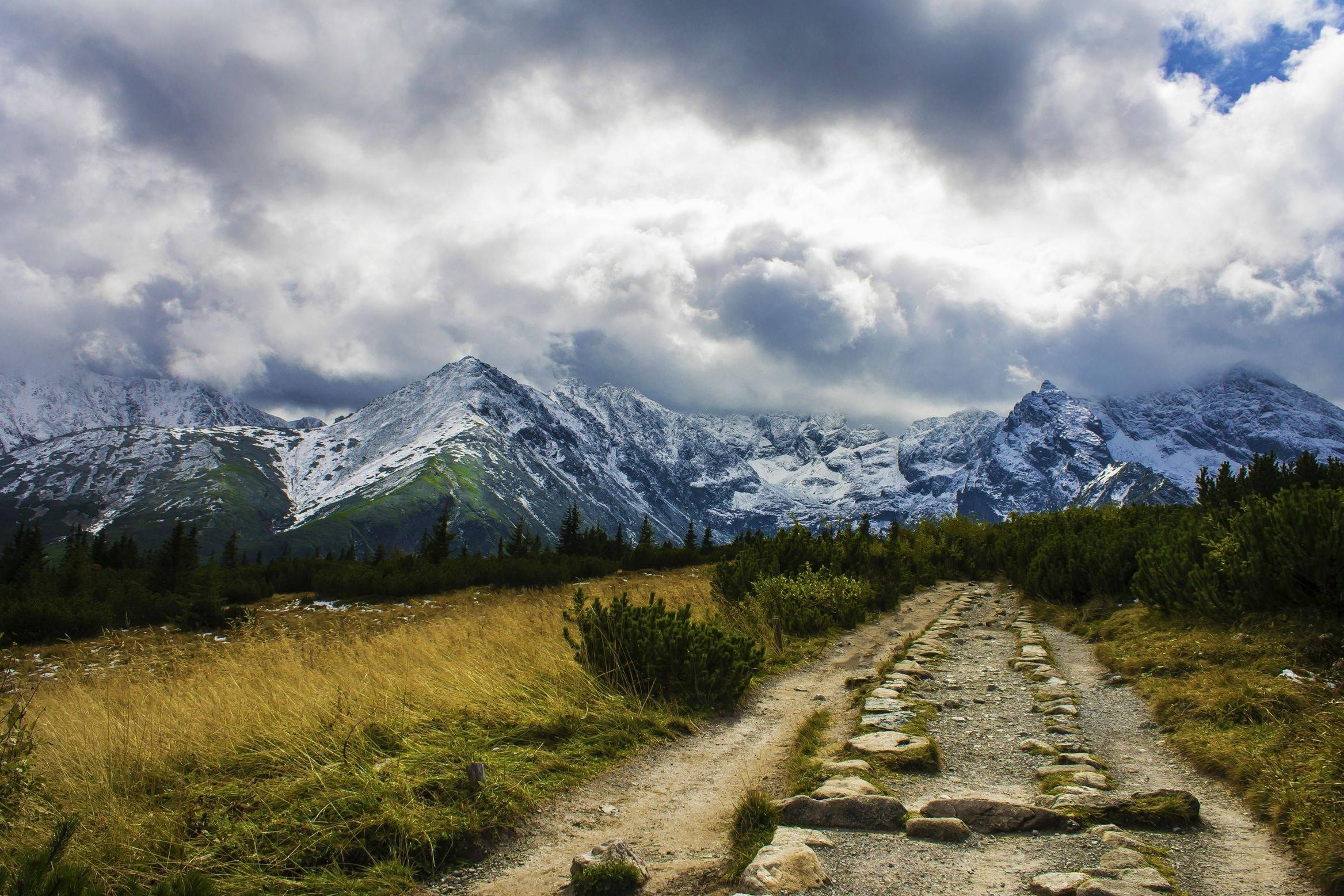nature, landscape, mountains, Tatra Mountains, Slovakia, snowy peak, dirt road, plants, trees, clouds, stones, pine trees, forest, HD Wallpaper