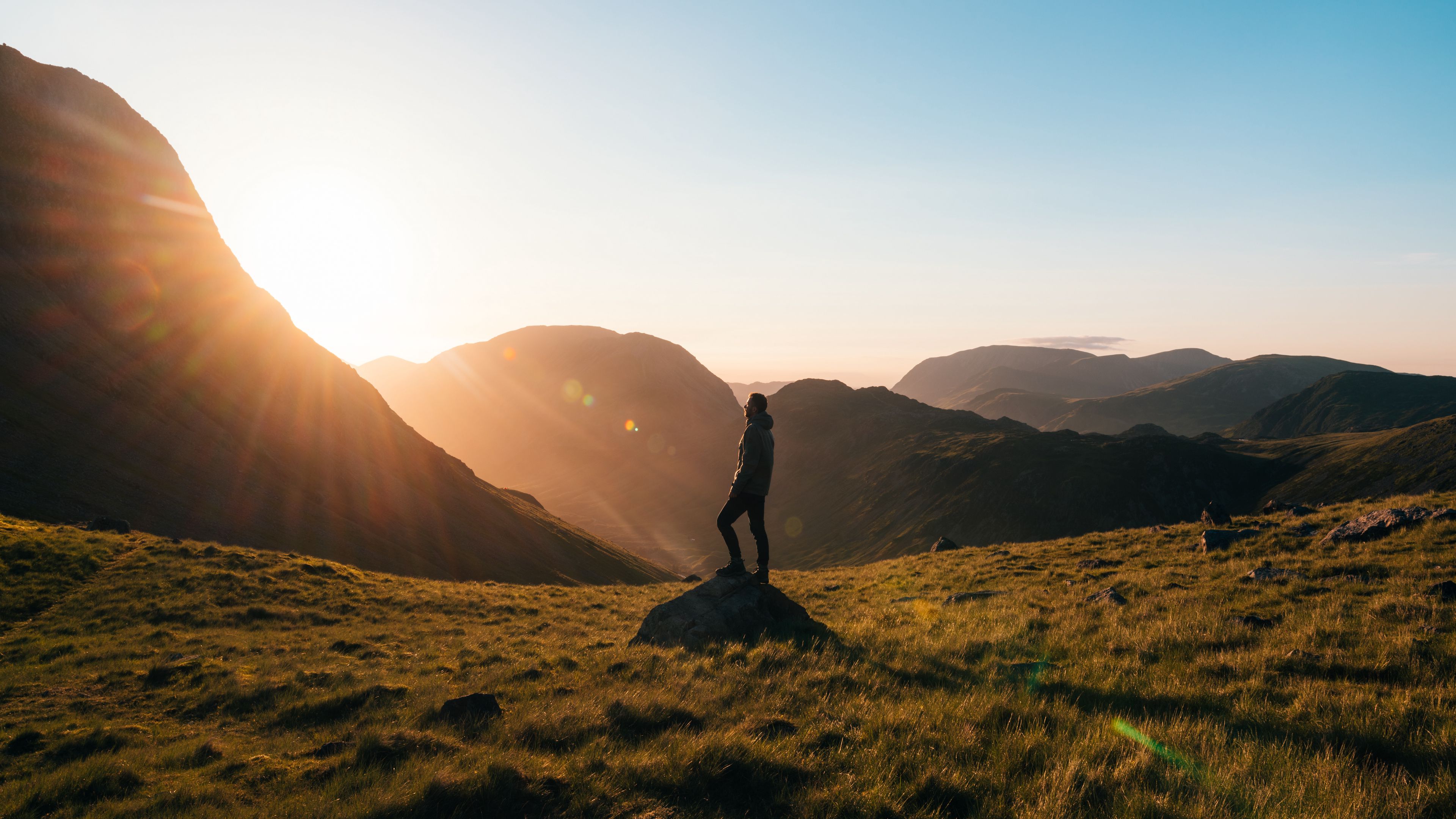 man, mountains, hill, sunlight, 4k, HD Wallpaper