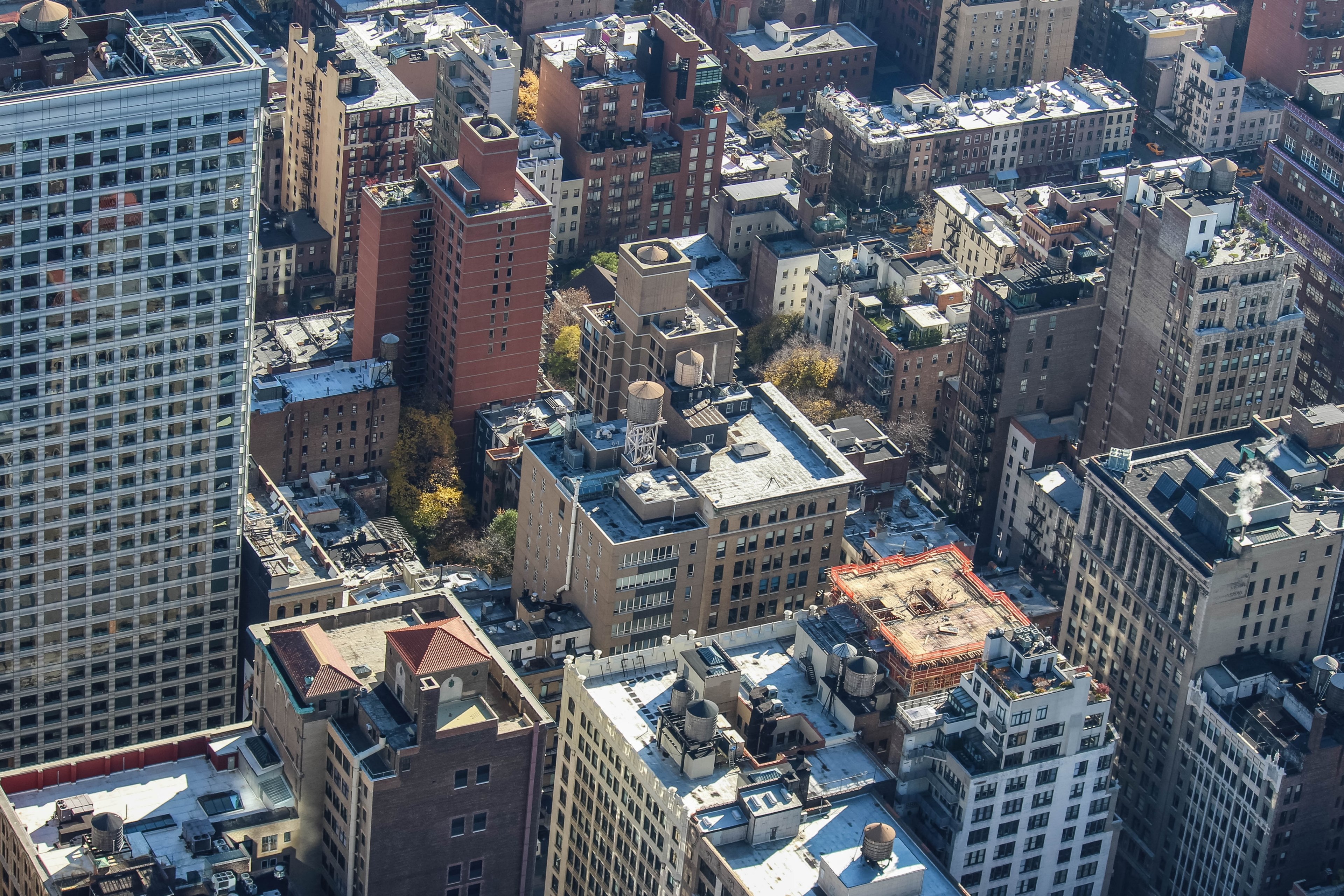 drone view of skyscrapers and building rooftops in an urban area, drone skyscrapers 4k, HD Wallpaper