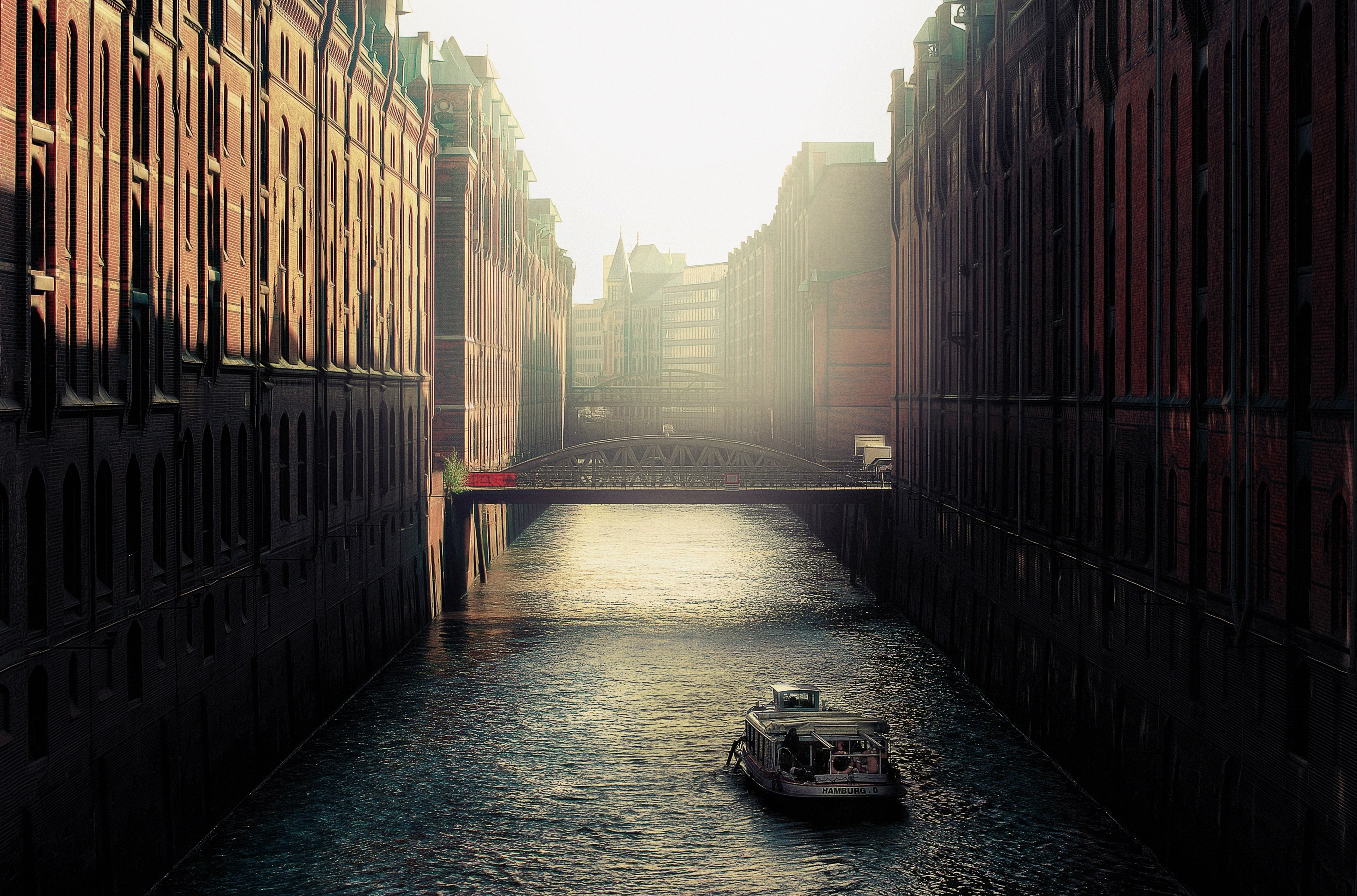 boat rides down the canal lined with bridges in speicherstadt, ferry rides in germany 4k, HD Wallpaper