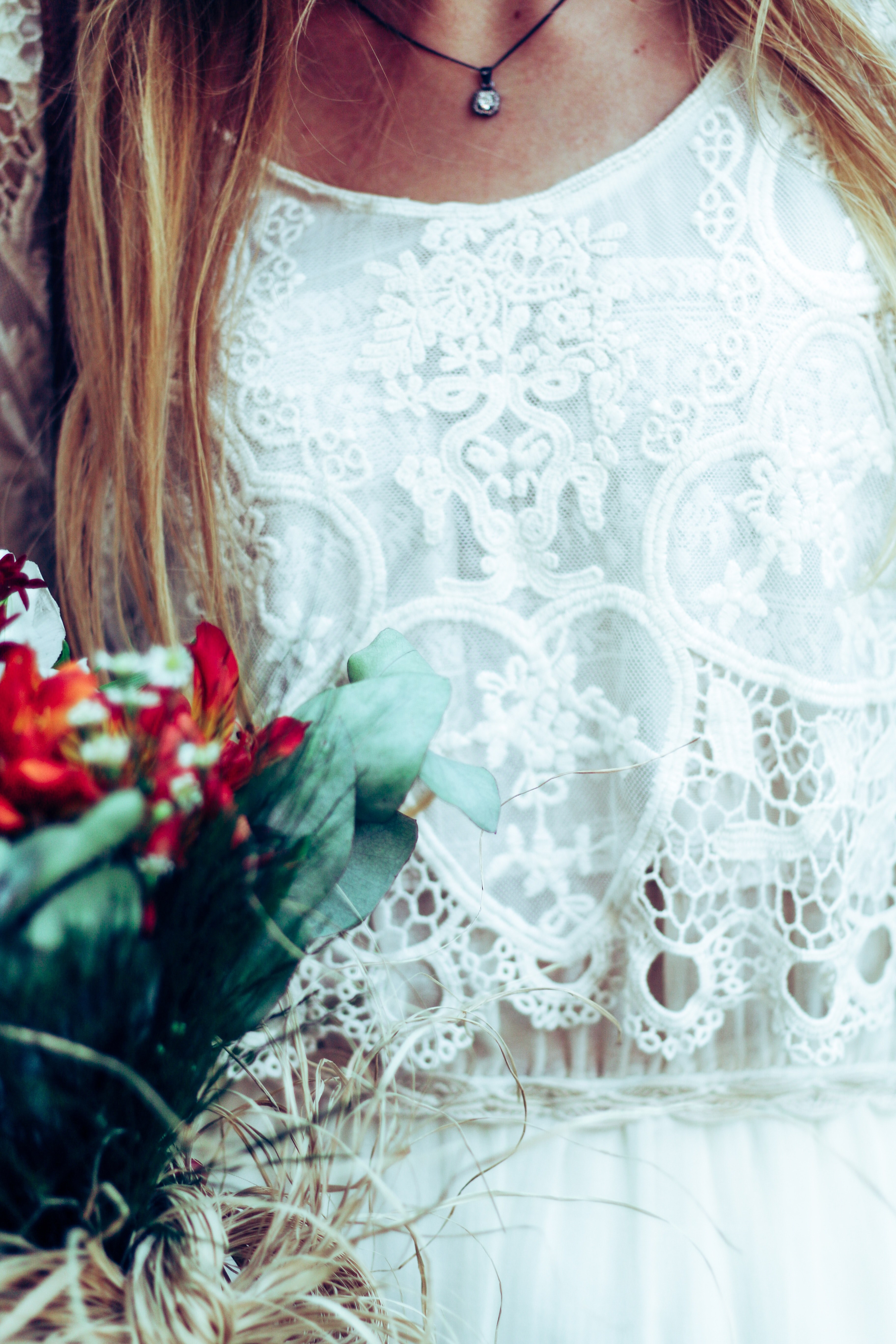 a woman in a laced dress holding a small floral bouquet, close up of a bride with a bouquet 4k, Phone HD Wallpaper