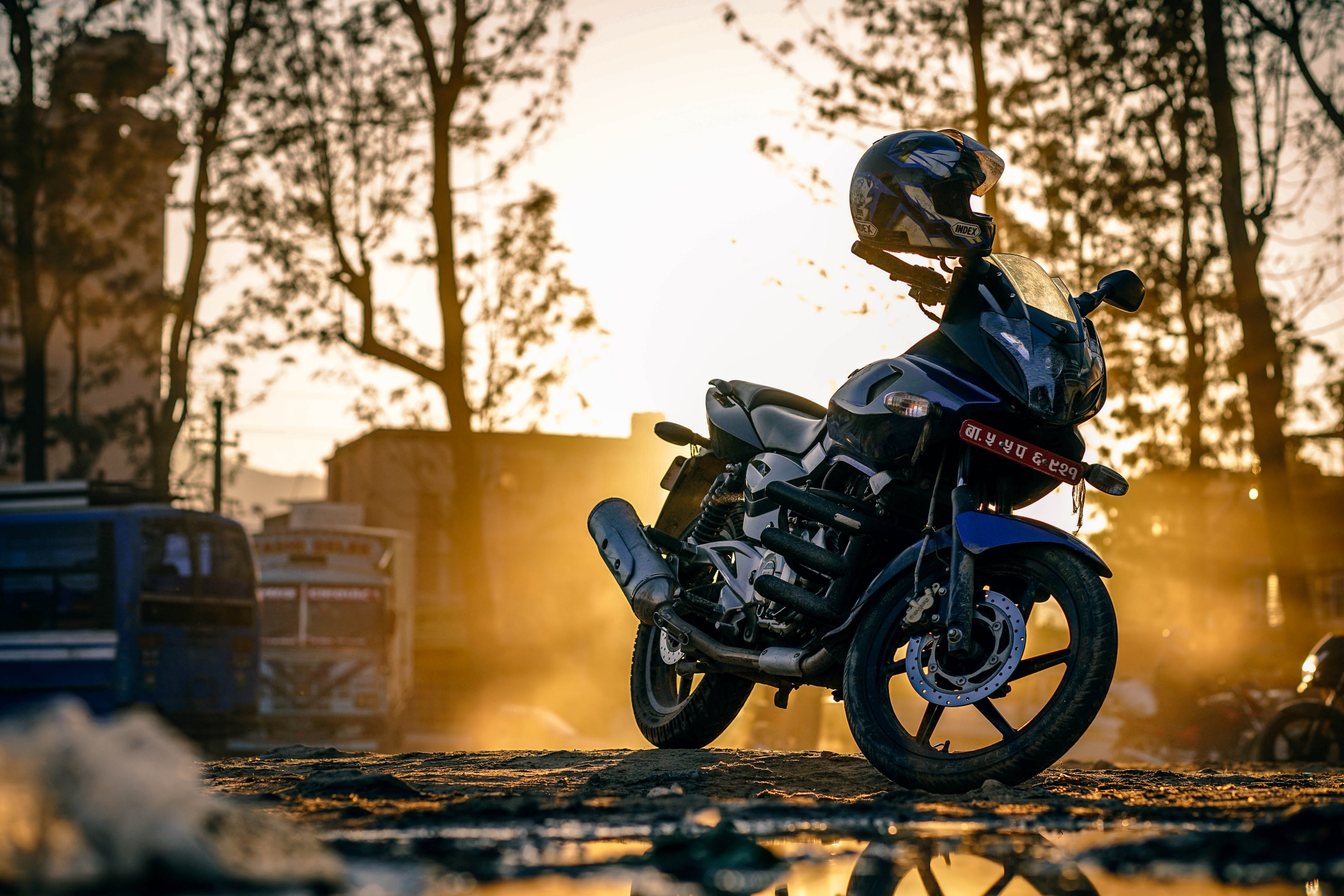 a motorcycle parked on a roadside in kathmandu at sunset, parked motorcycle 4k, HD Wallpaper