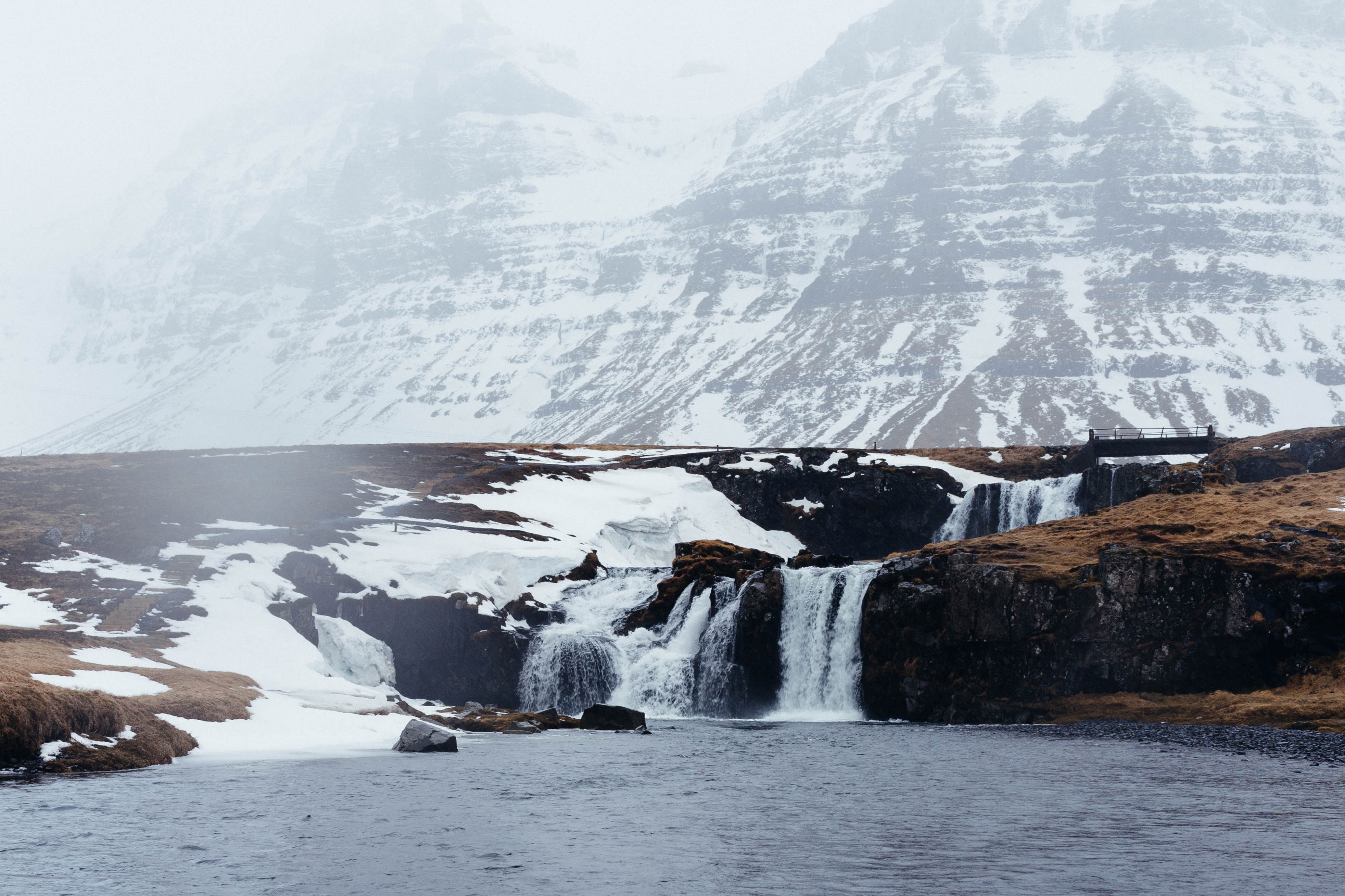 small waterfalls feed into a lake at the foot of a snowy mountain, waterfalls at snowy mountain 4k, HD Wallpaper