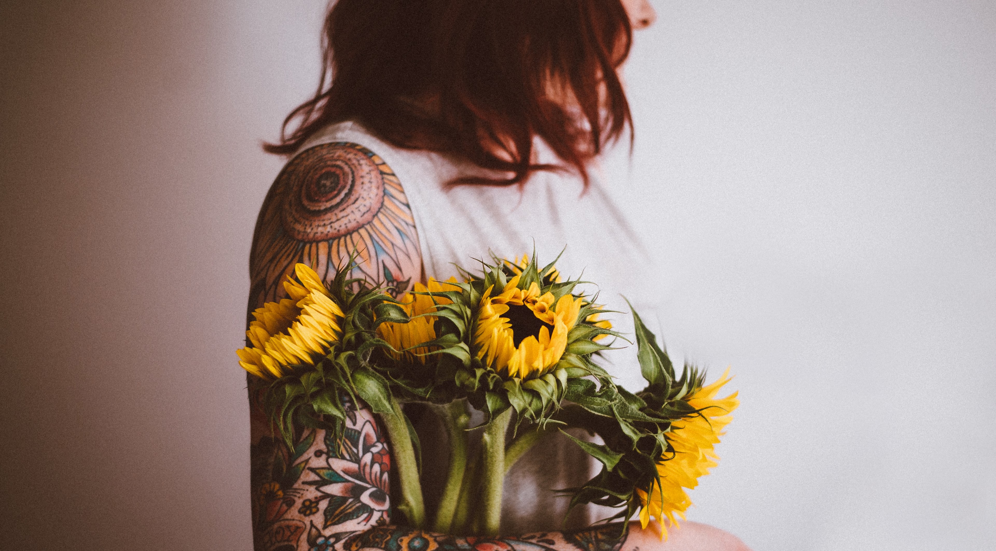 tattooed woman holding sunflowers 4k, HD Wallpaper