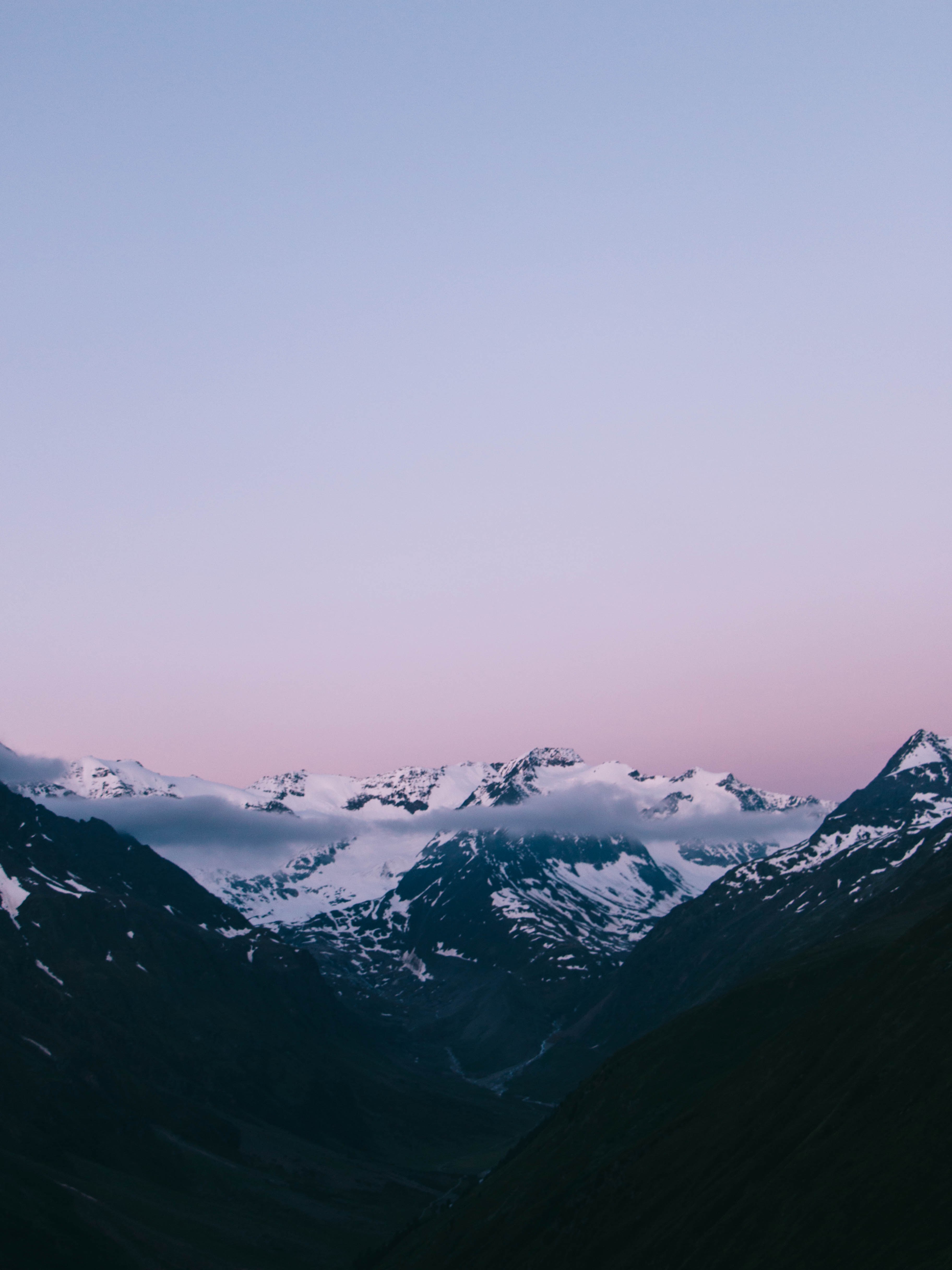the top of snowy mountains under a light blue and violet sky, mountains under violet sky 4k, Phone HD Wallpaper