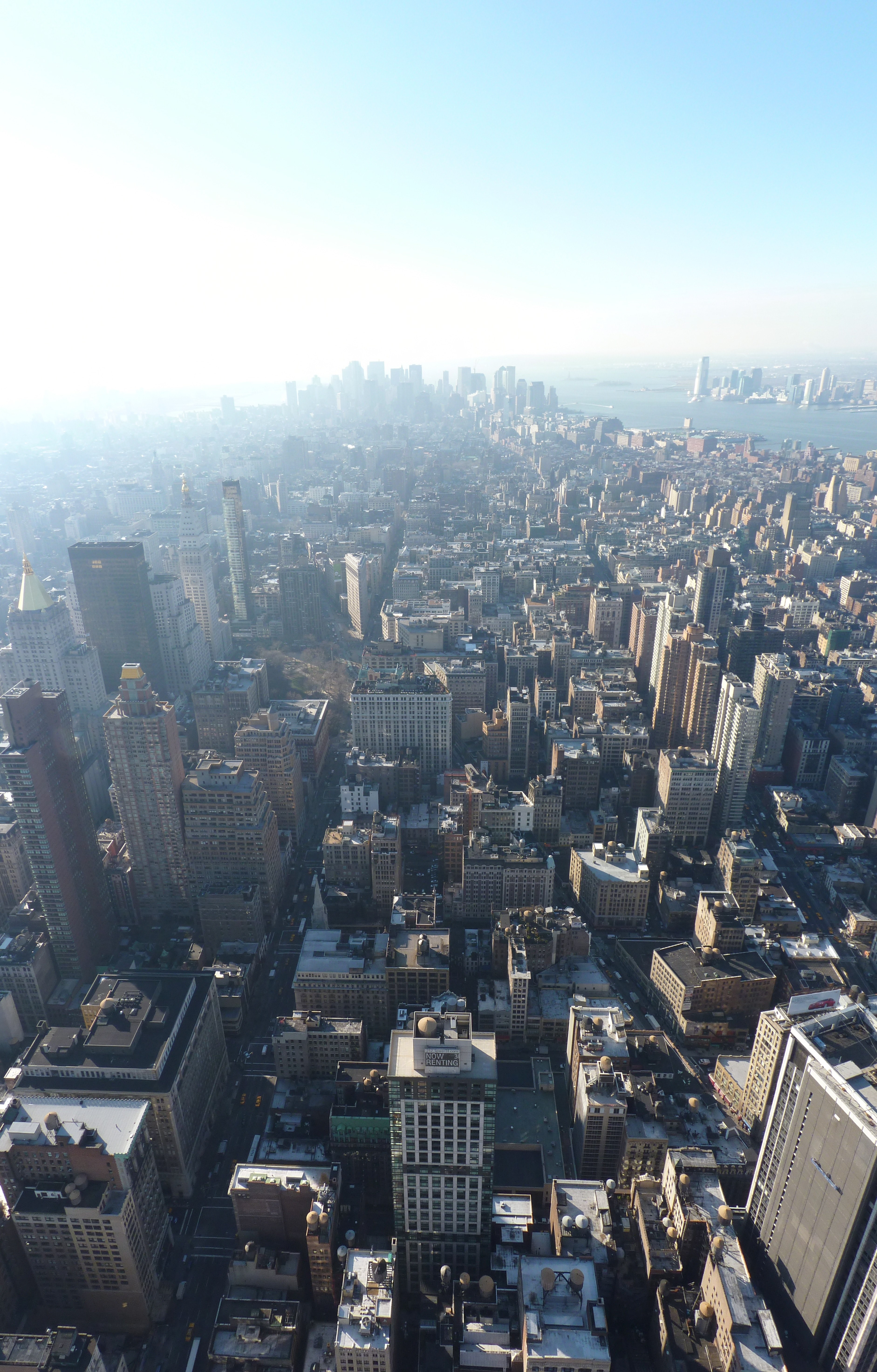 aerial view of new york citys skyscrapers and apartment buildings on a sunny day, it goes on for miles 4k, Phone HD Wallpaper