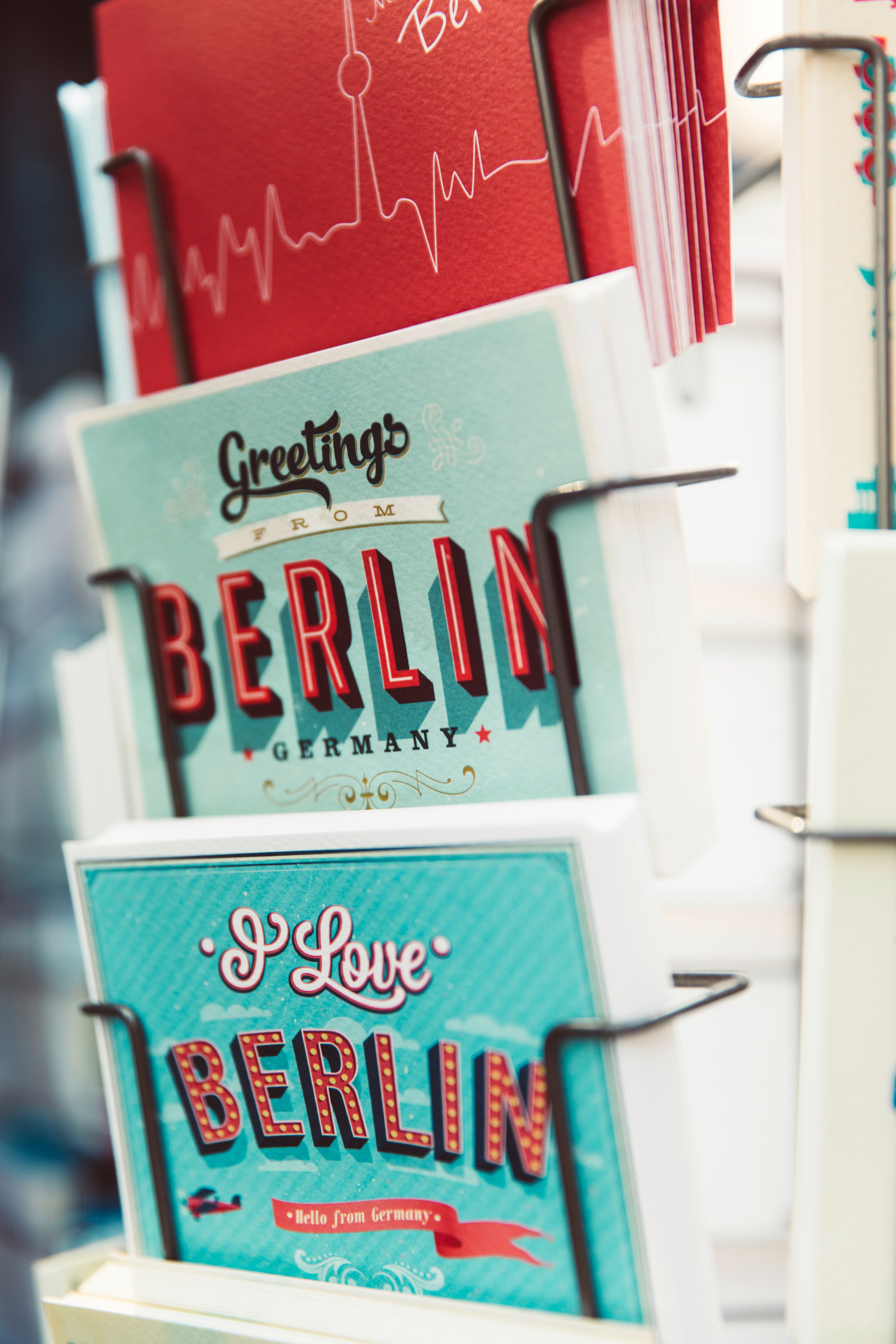 colorful postcards from berlin in a stand, postcards from berlin 4k, Phone HD Wallpaper