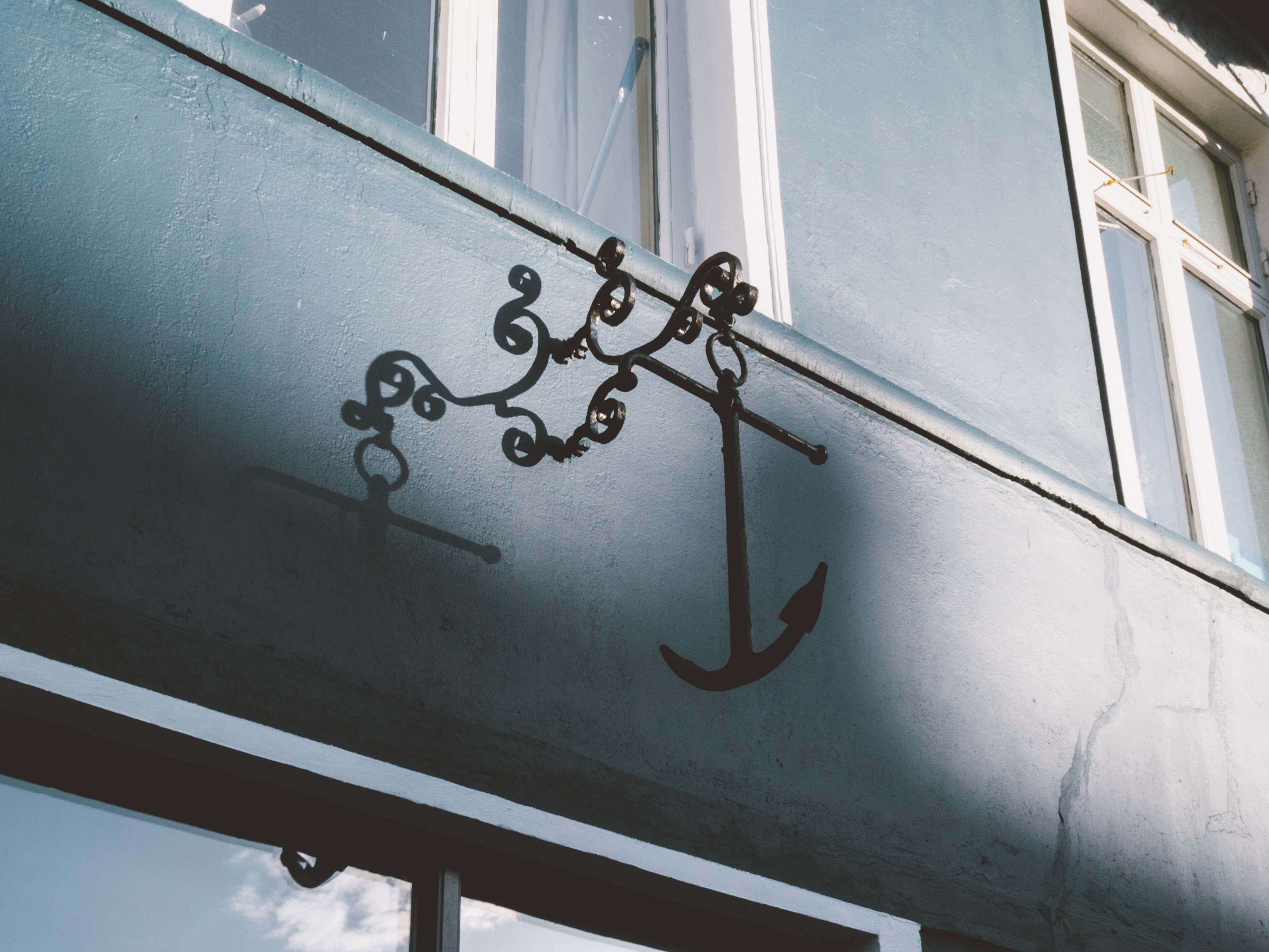 a steel anchor fixture on a blue building wall, anchor 4k, HD Wallpaper