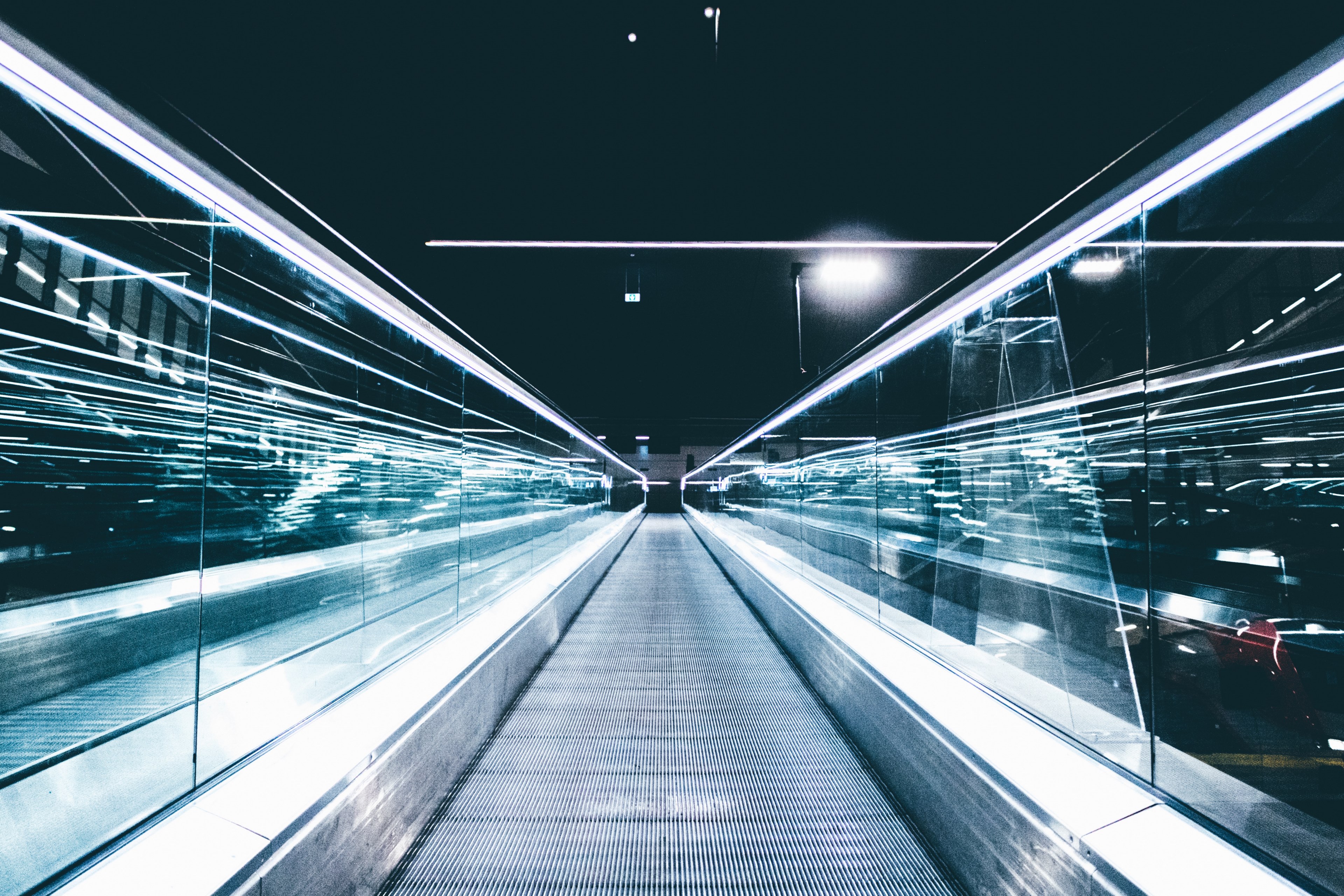 glass balustrades of an empty escalator reflect lights at a railway station, lost in future 4k, HD Wallpaper