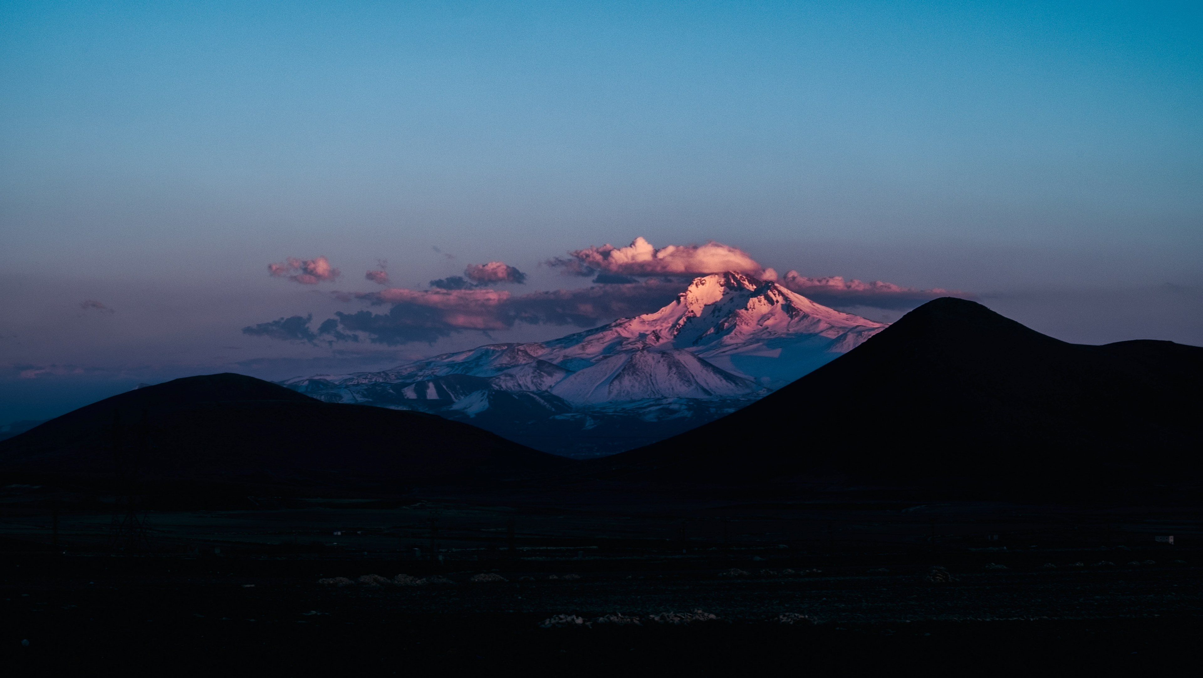the volcanic mount erciyes on the horizon behind silhouettes of lower mountains, erciyes mountain 4k, HD Wallpaper