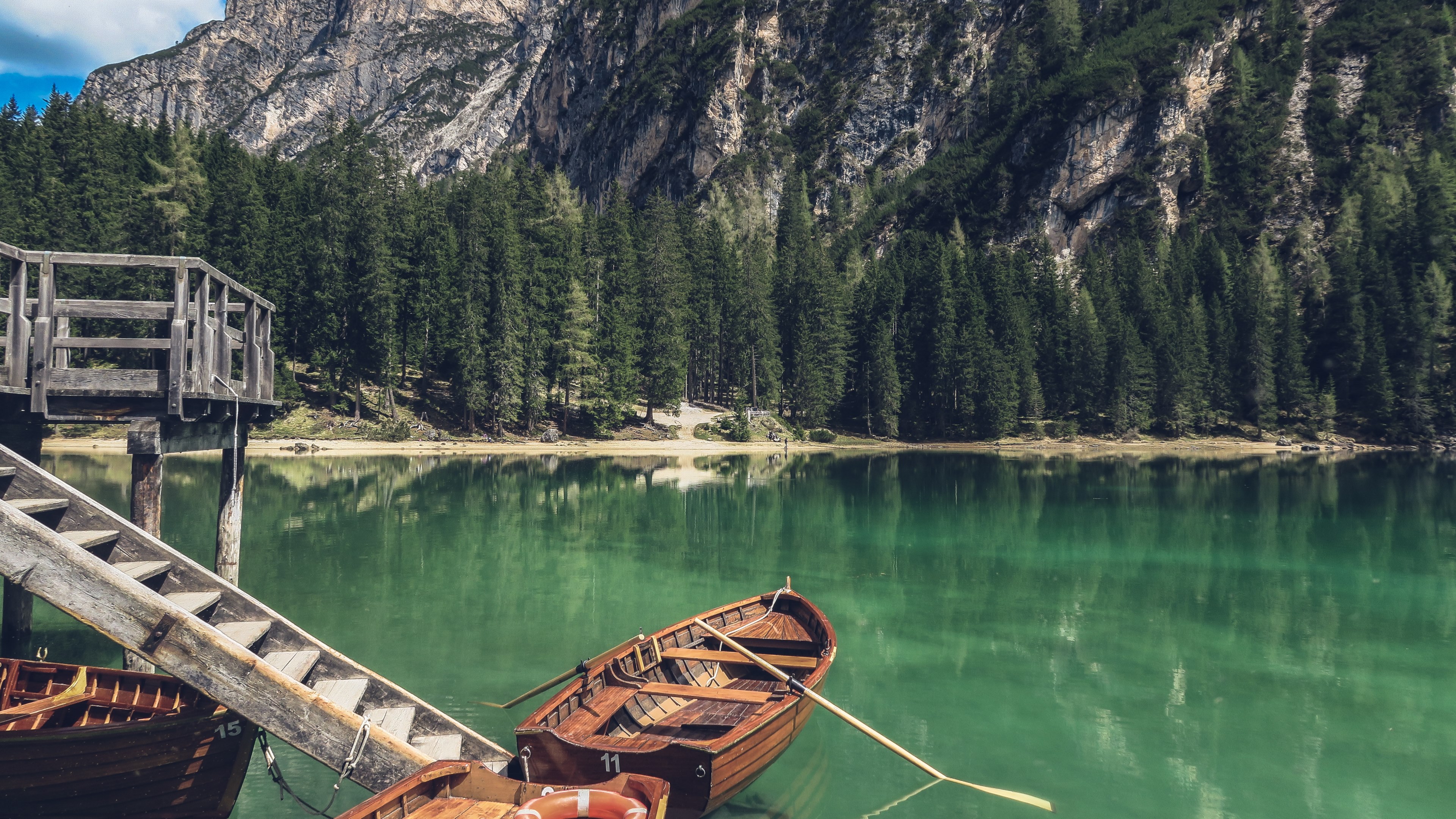 wooden boats by a jetty on lake pragser wildsee, boats on a green lake 4k, HD Wallpaper