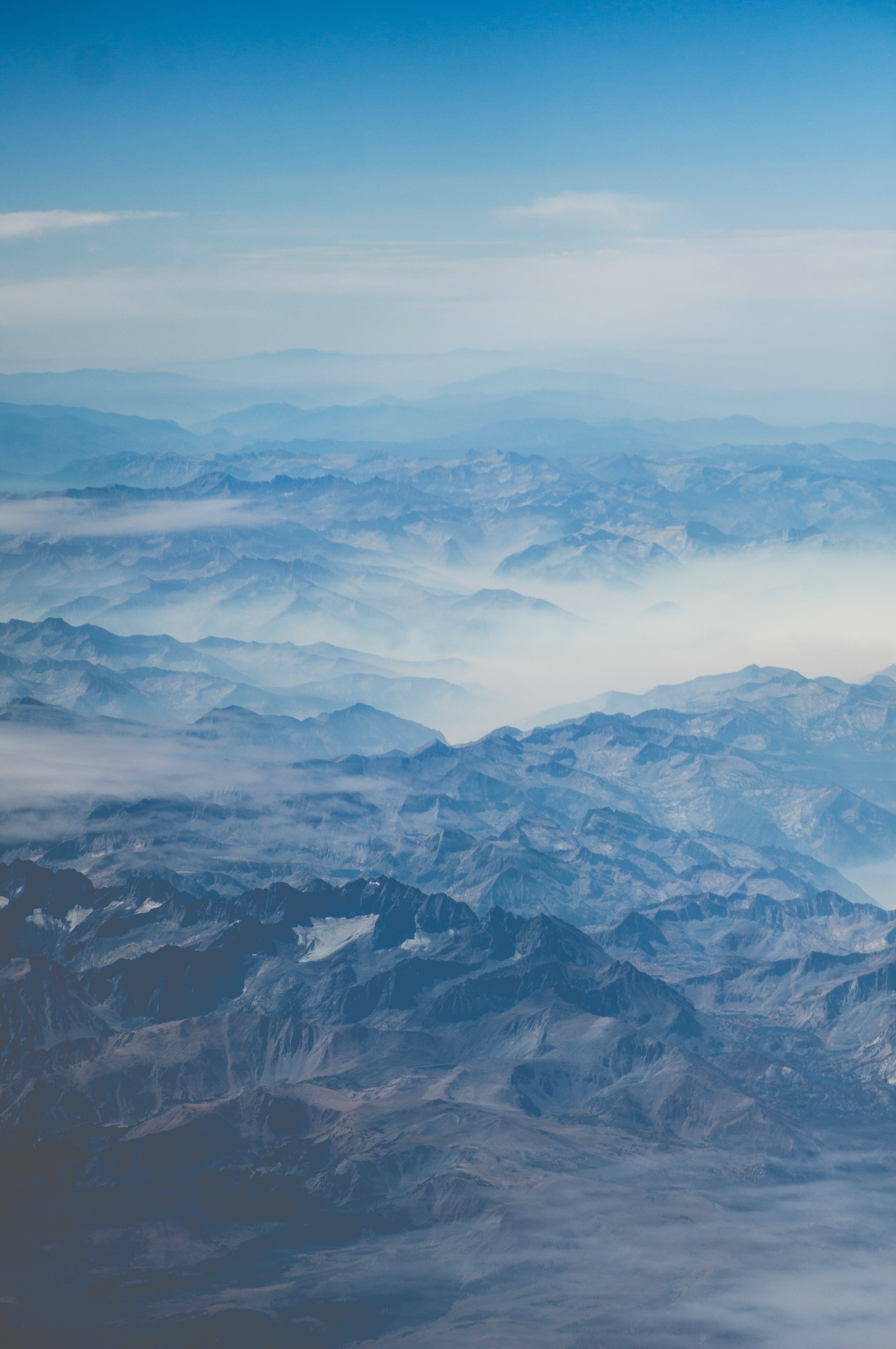 rugged mountain ridges covered in blue clouds and fog, adventures awaits 4k, Phone HD Wallpaper