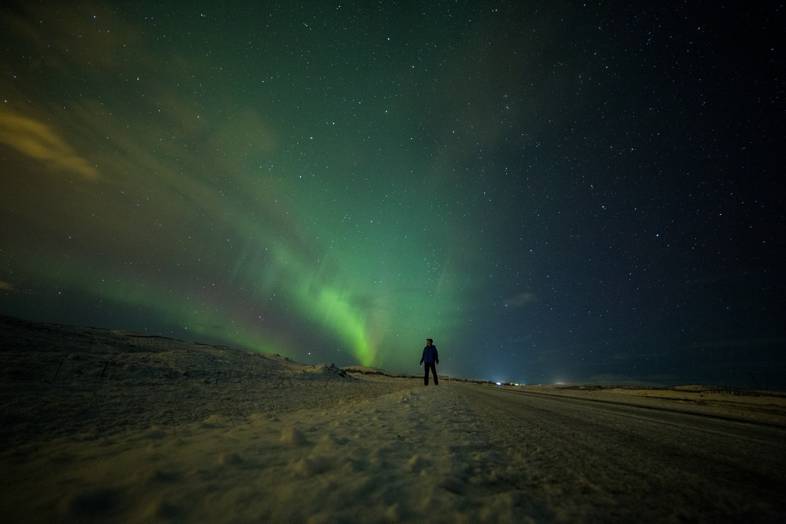 a person watching the vibrant green northern lights display, _northern lights 4k, HD Wallpaper