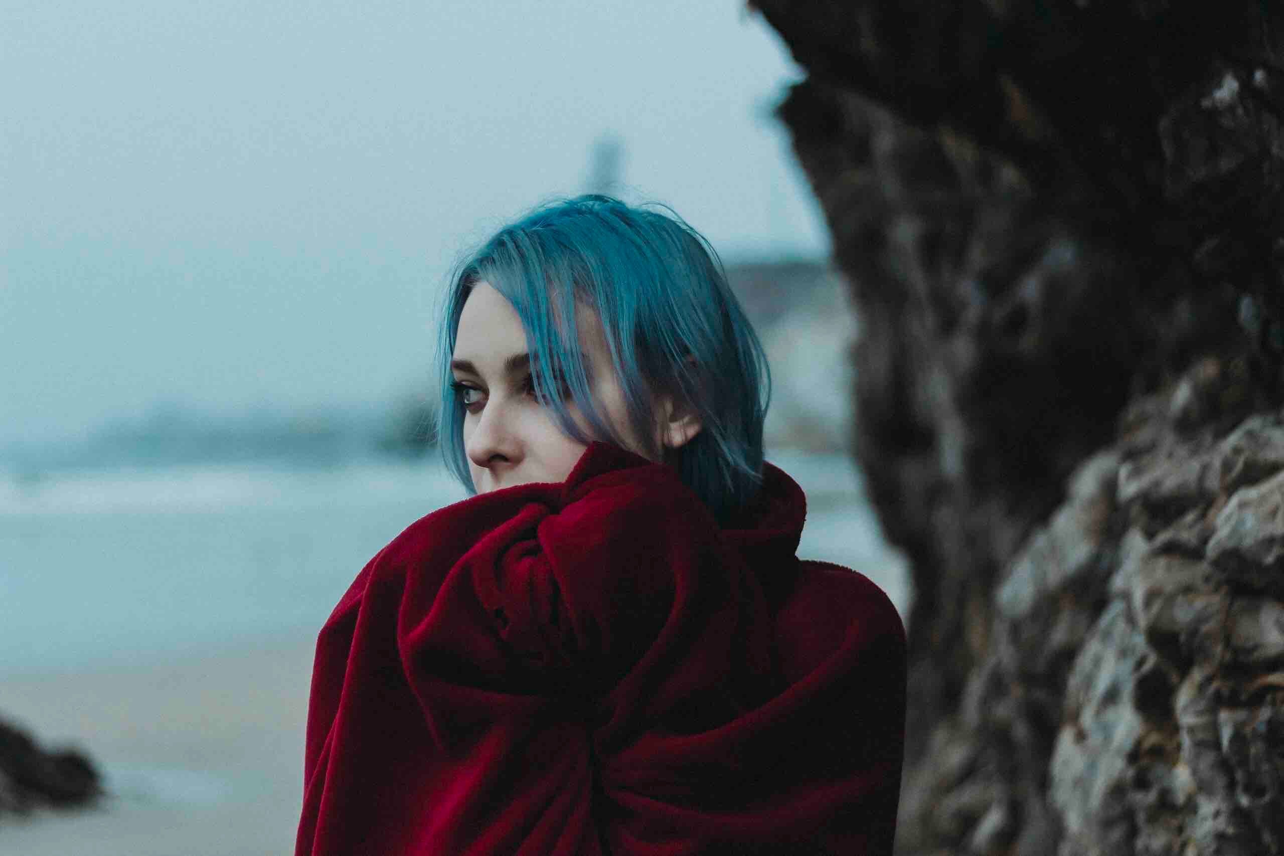 woman with blue hair and a red coat posing by the rocks at pismo beach, pismo beach ca 4k, HD Wallpaper