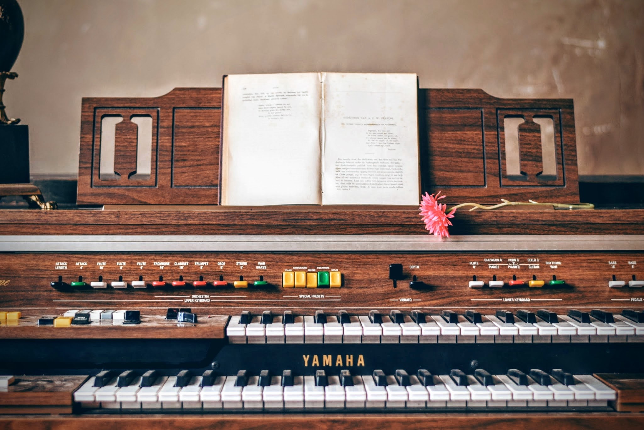 an open book and a pink flower on top of a yamaha organ, yamaha organ with a pink flower 4k, HD Wallpaper