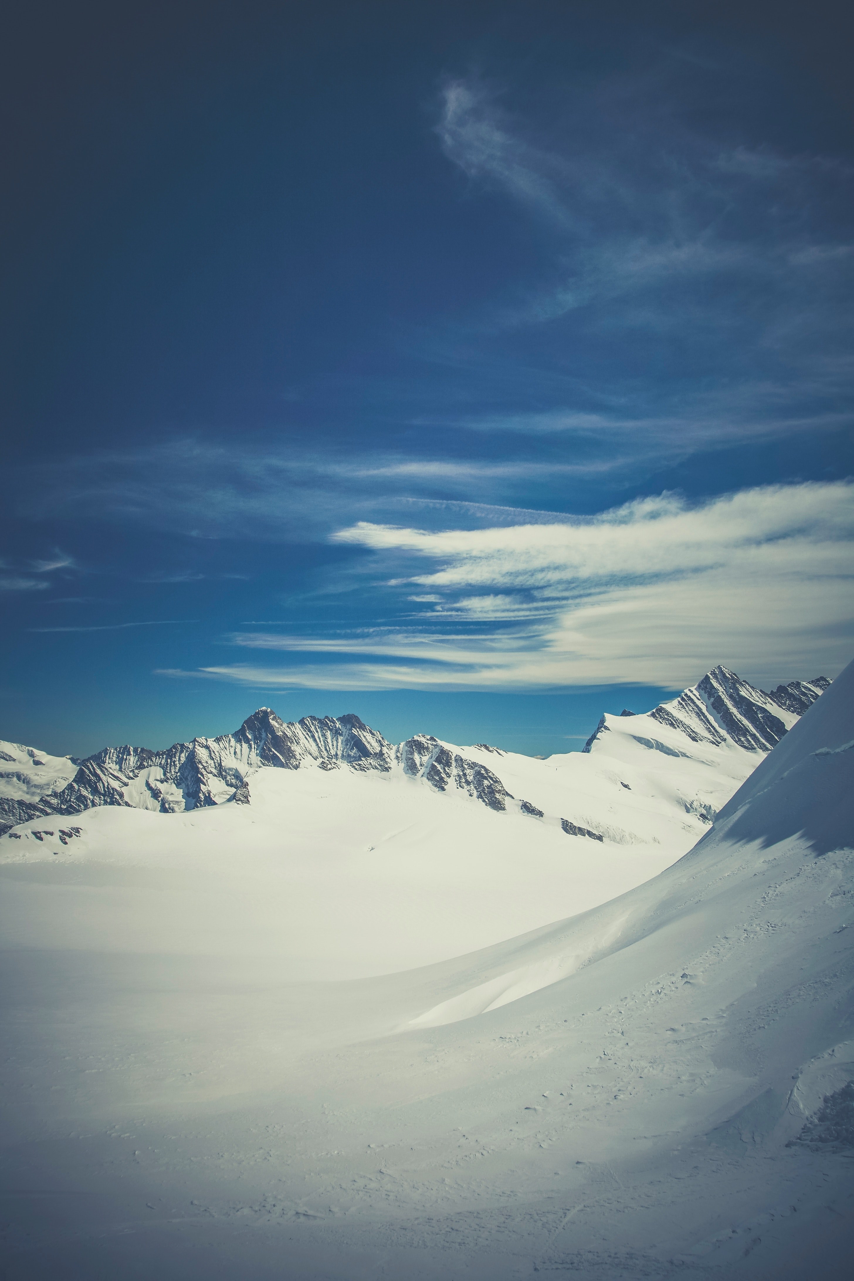 snowcapped mountains in ewigschneefld where the peak almost reaches the clouds, snowy swiss mountainscape 4k, Phone HD Wallpaper