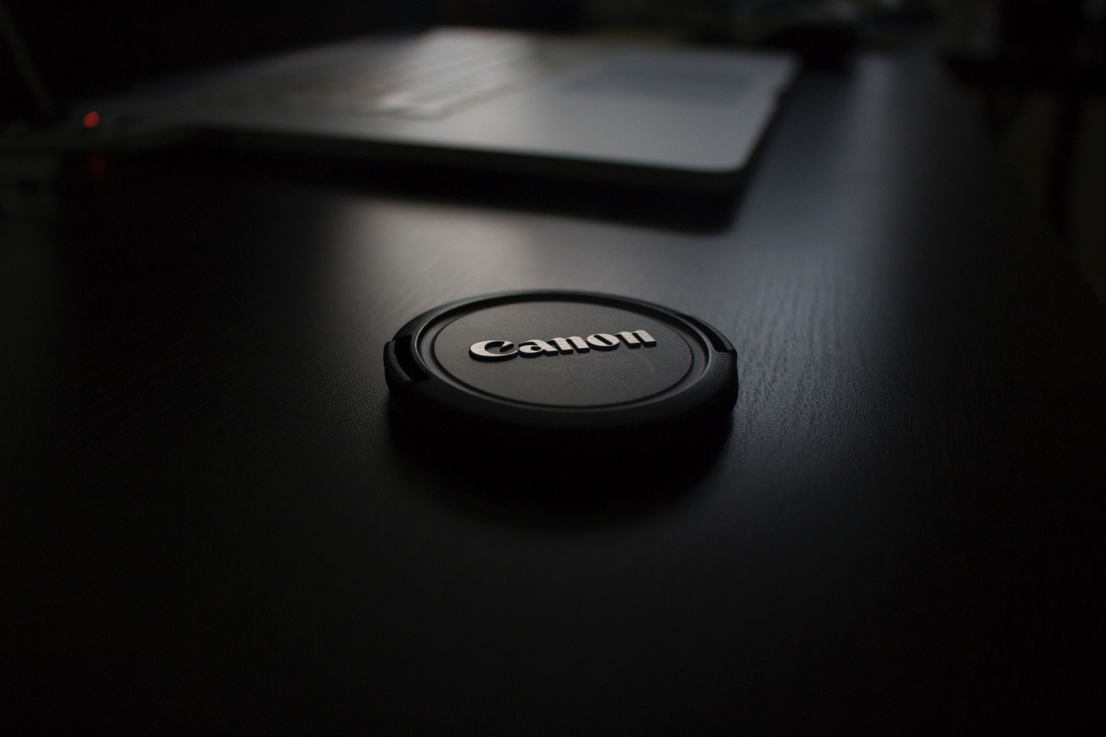 a canon lens cap on a table, canon lens cap on the table 4k, HD Wallpaper