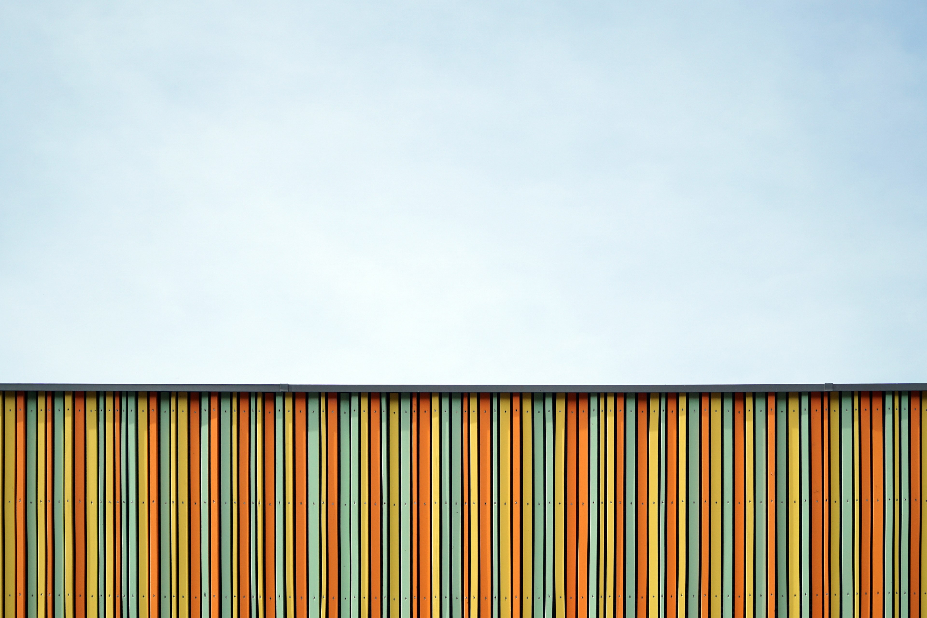 a colorful striped line facade and clouded skyline in nuremberg bavaria in germany, colorful facade in germany 4k, HD Wallpaper
