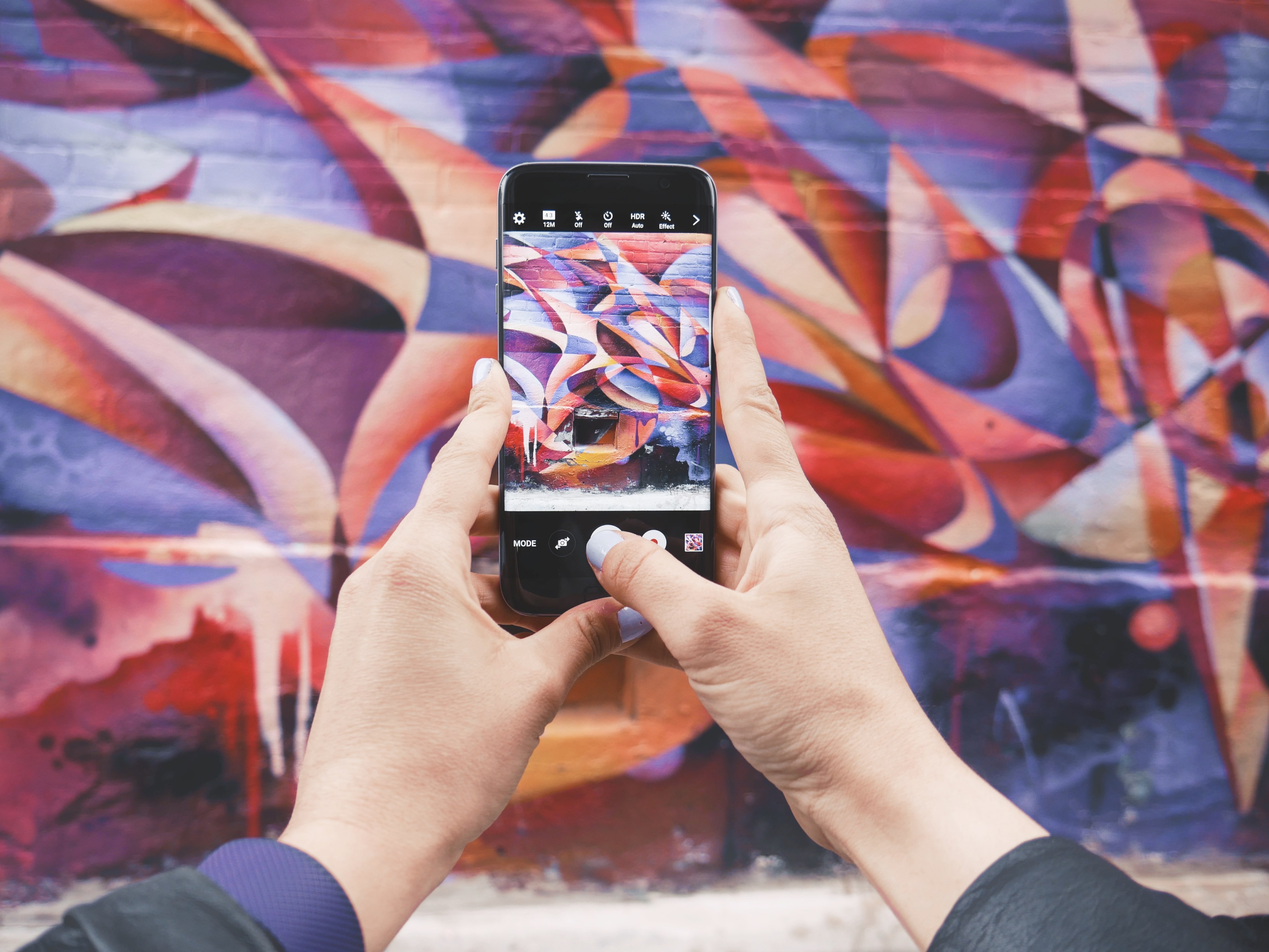 hands holding iphone taking photo of abstract colorful graffiti art, iphone taking picture of graffiti 4k, HD Wallpaper