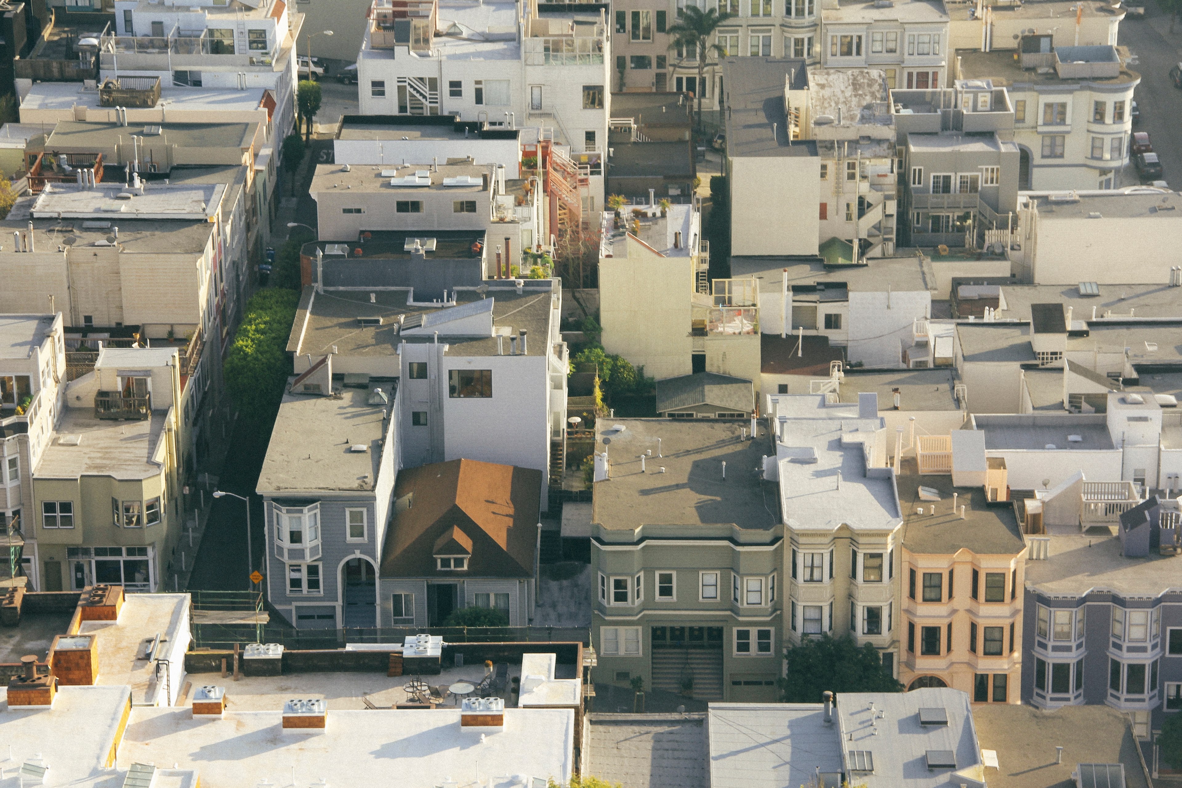 drone view of the roofs of houses and apartments with varying architectural styles, drone view house roofs 4k, HD Wallpaper