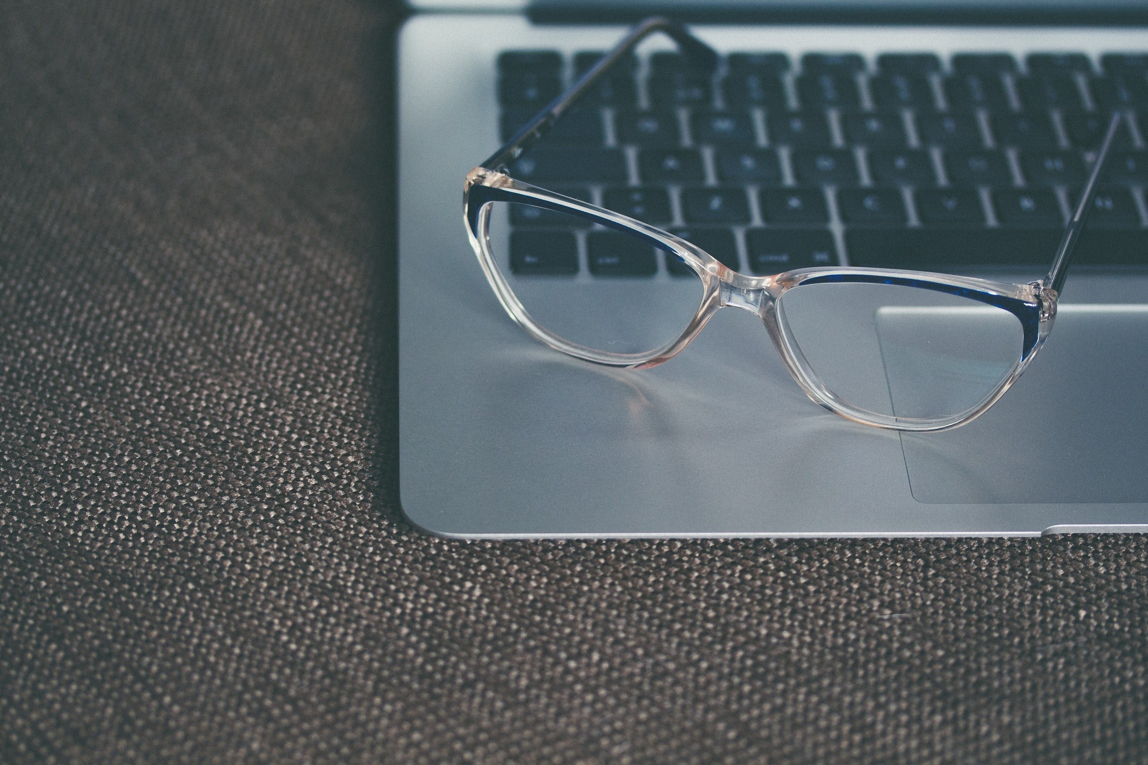 a pair of glasses on a macbook keyboard, glasses on laptop keyboard 4k, HD Wallpaper