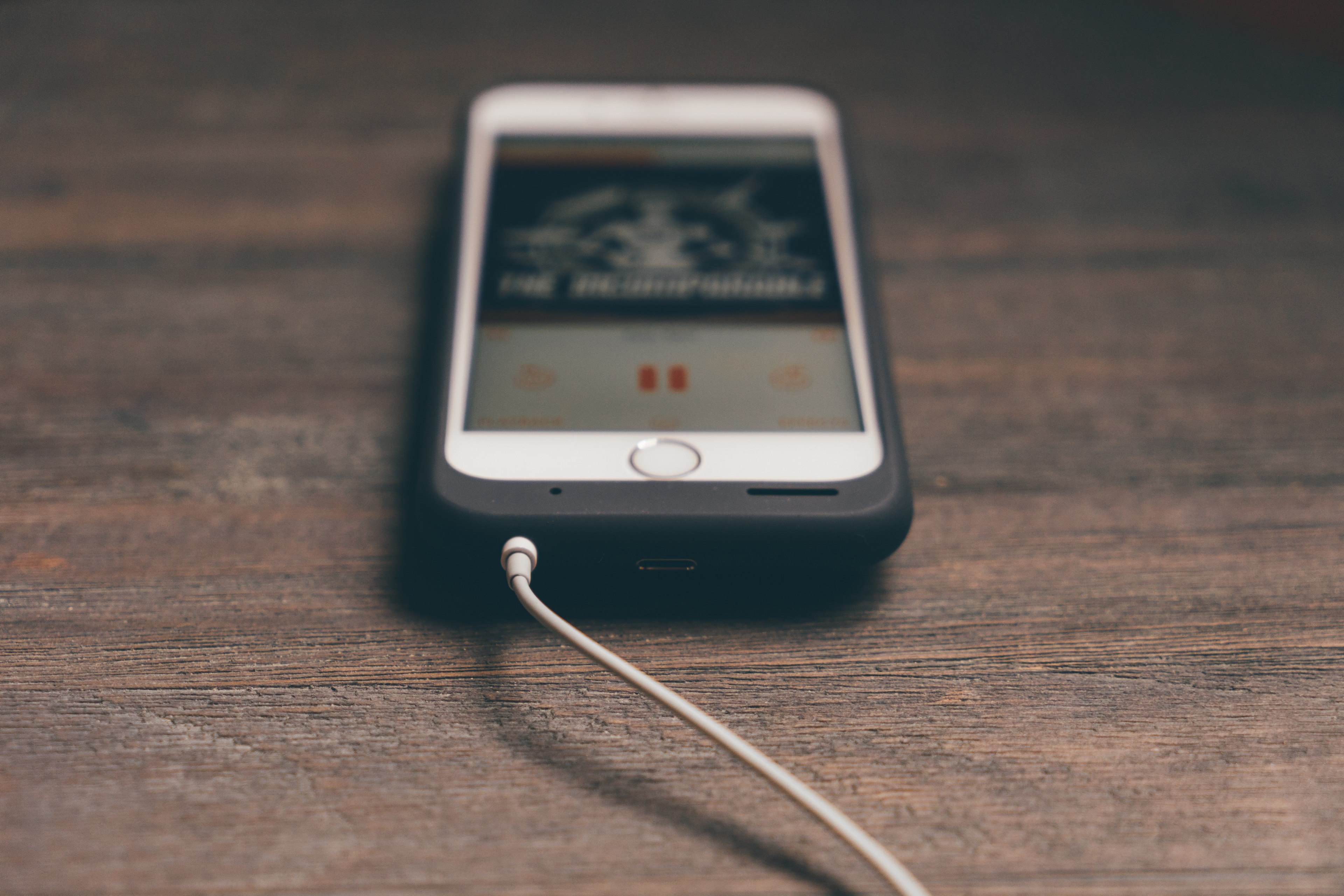 a white iphone with a music app on a wooden surface, playing music from a phone 4k, HD Wallpaper