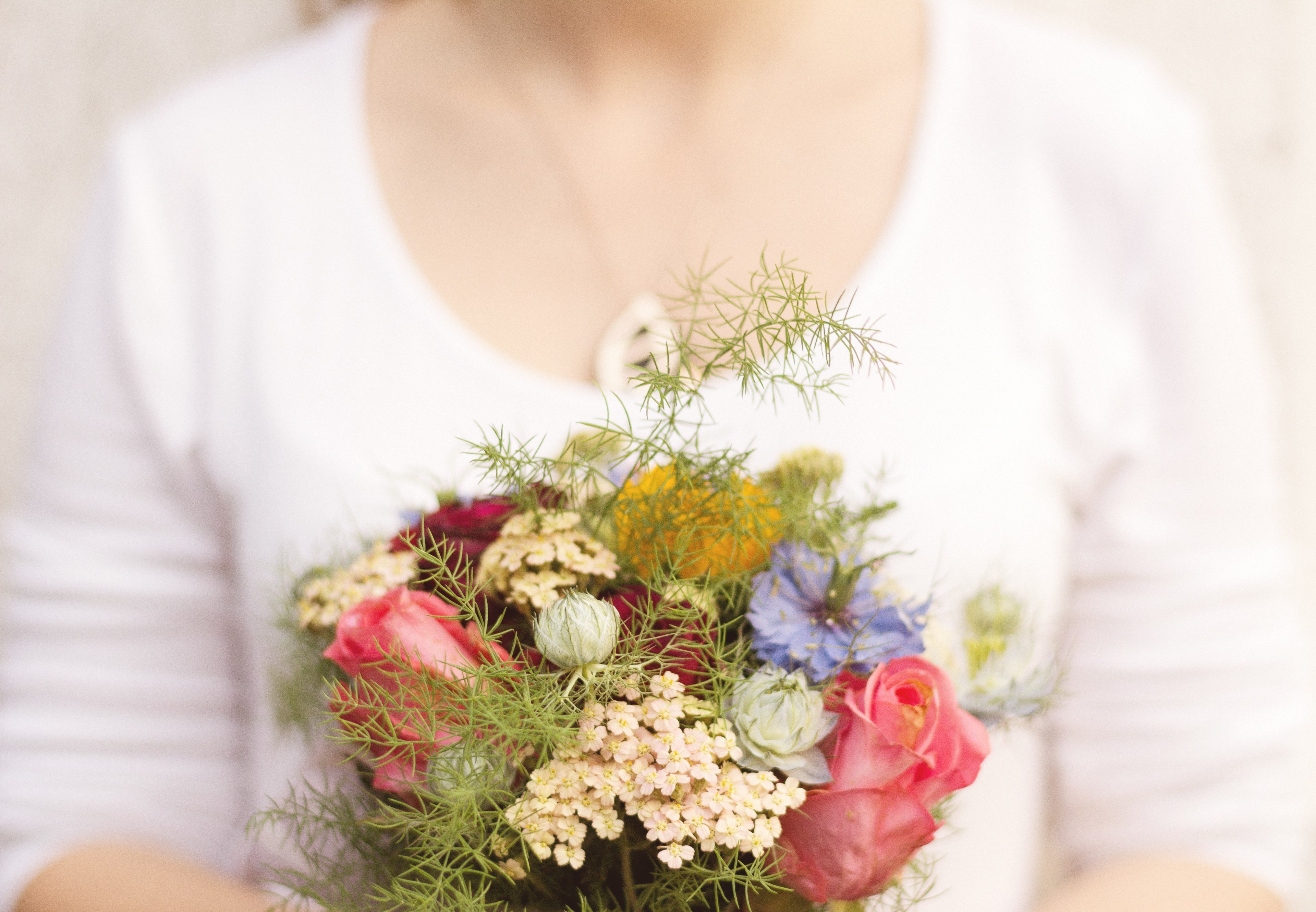 a woman holding a modest bouquet with various flowers, woman with a small bouquet 4k, HD Wallpaper