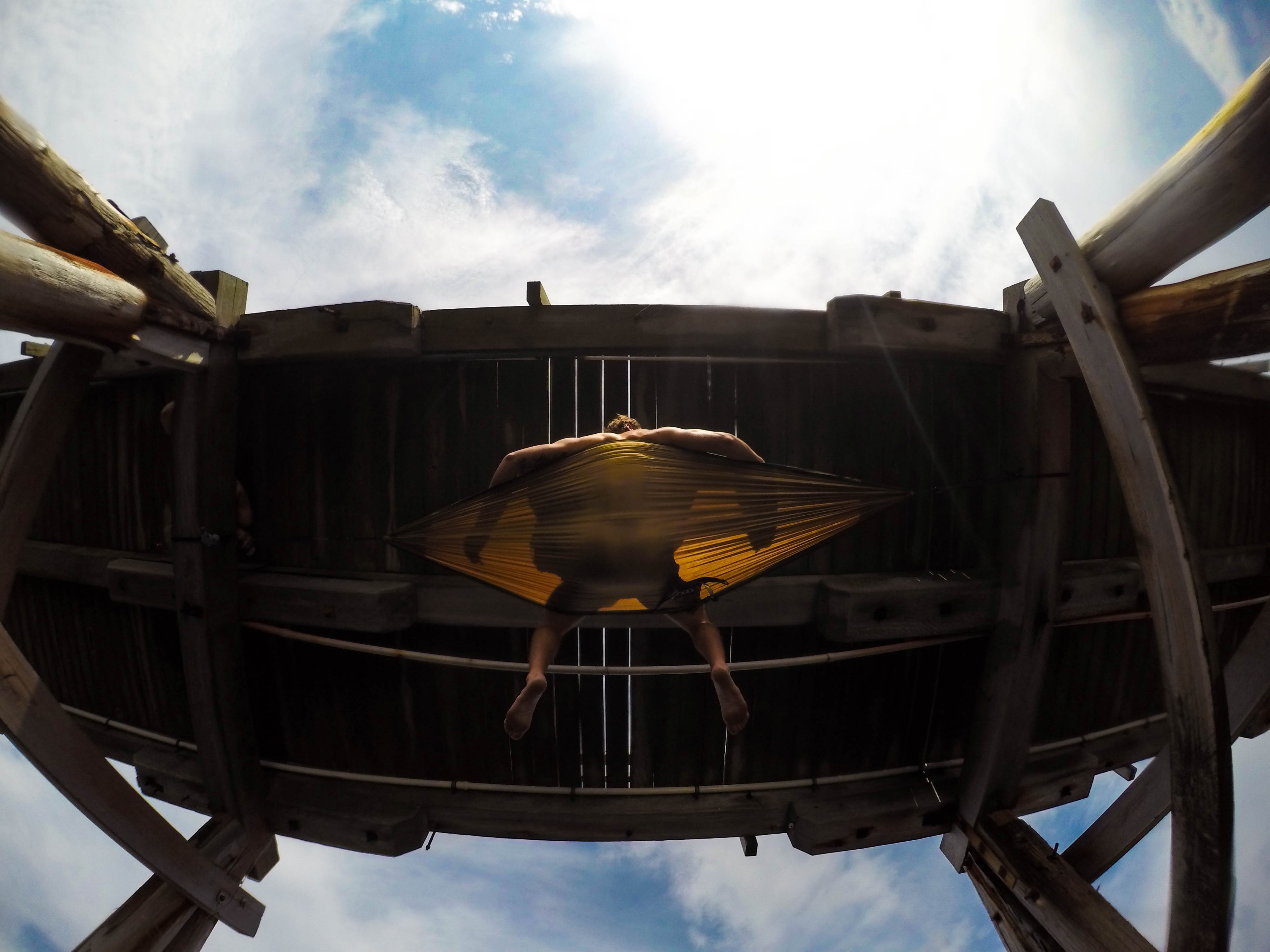 looking up at aman relaxing in a hammock under the pier at la perouse, a new perspective 4k, HD Wallpaper
