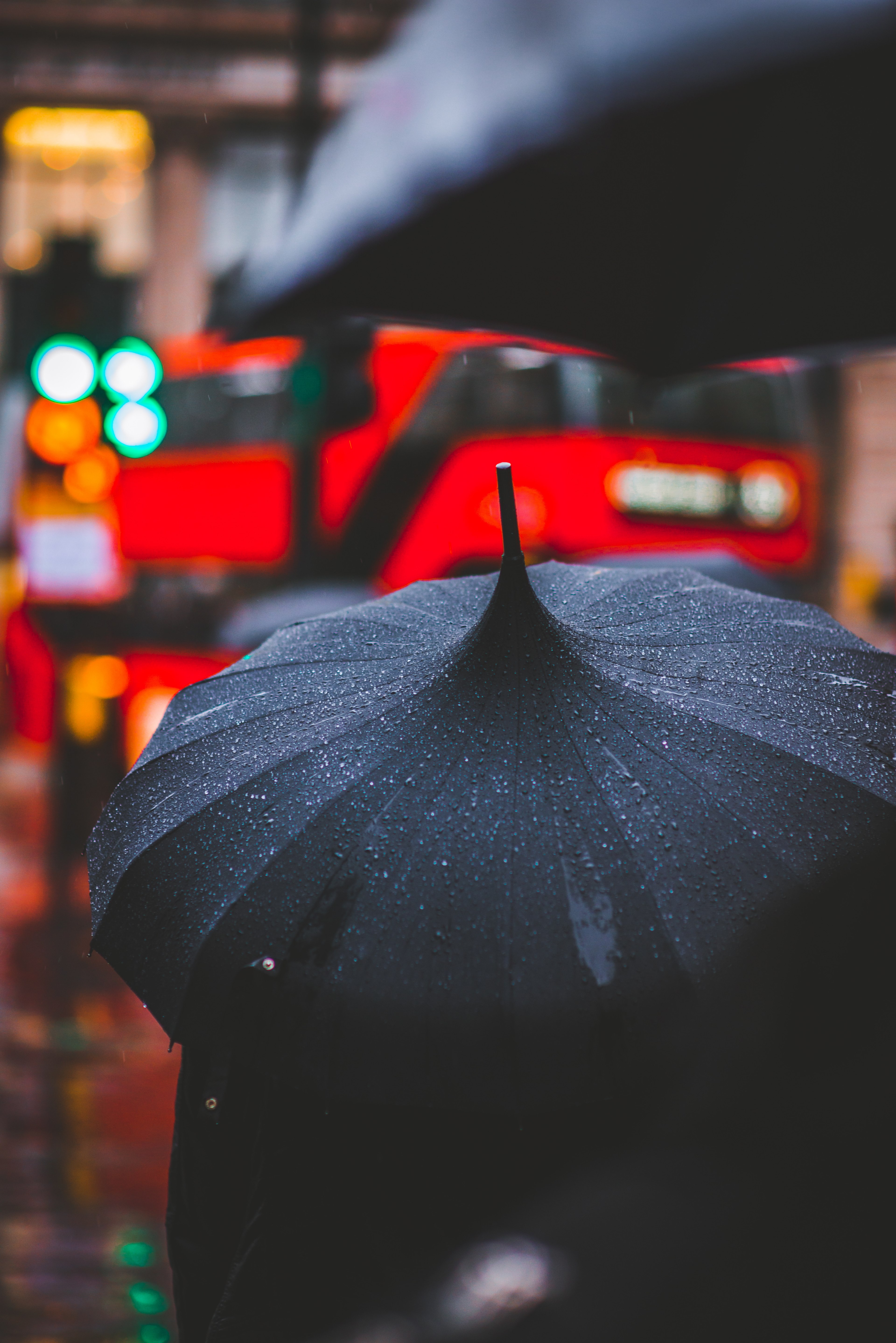 a person with a wet black umbrella in the streets of london, city colours 4k, Phone HD Wallpaper