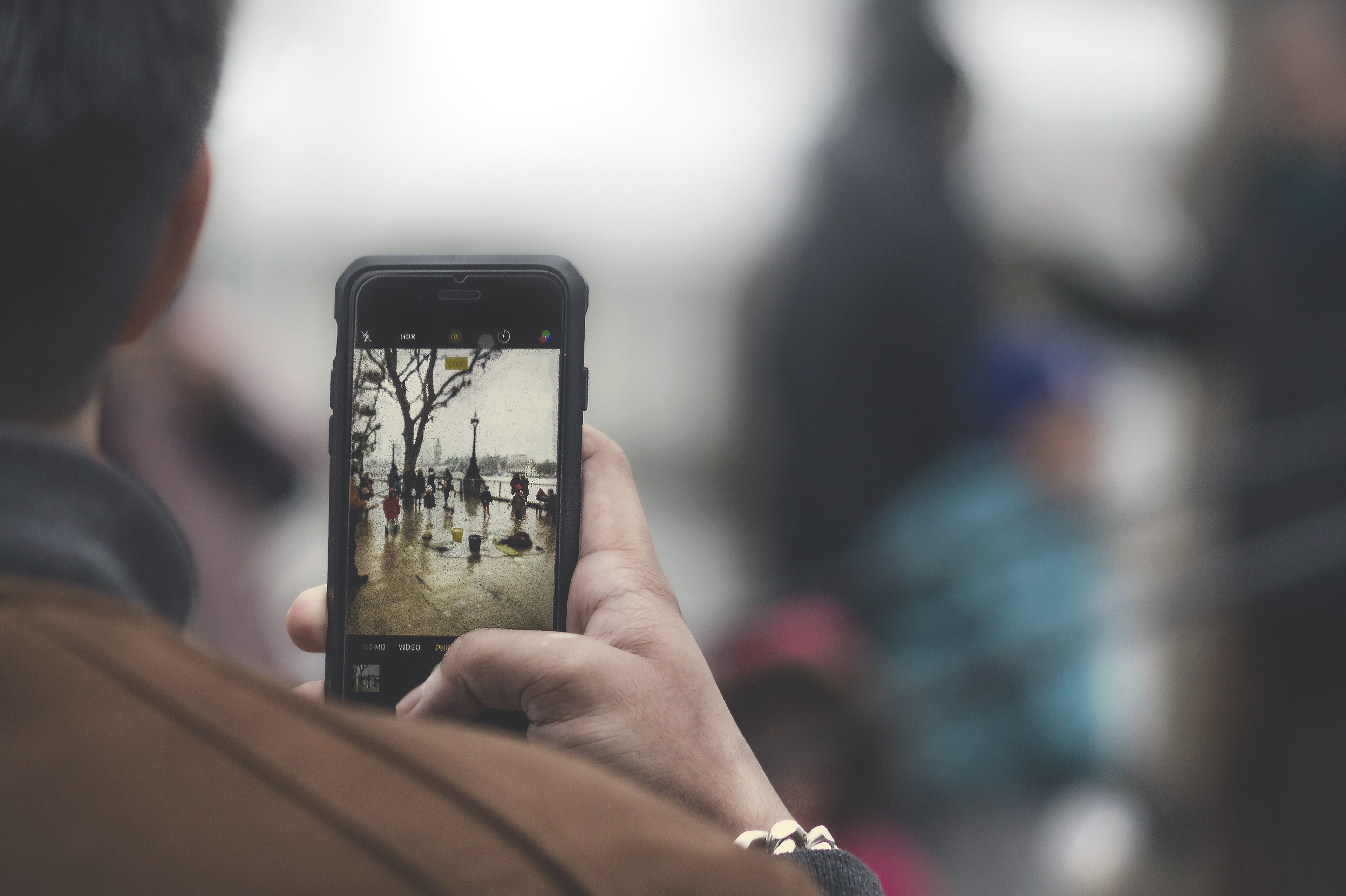 an over the shoulder shot of a person taking a photo with a smartphone, smartphone photographer 4k, HD Wallpaper