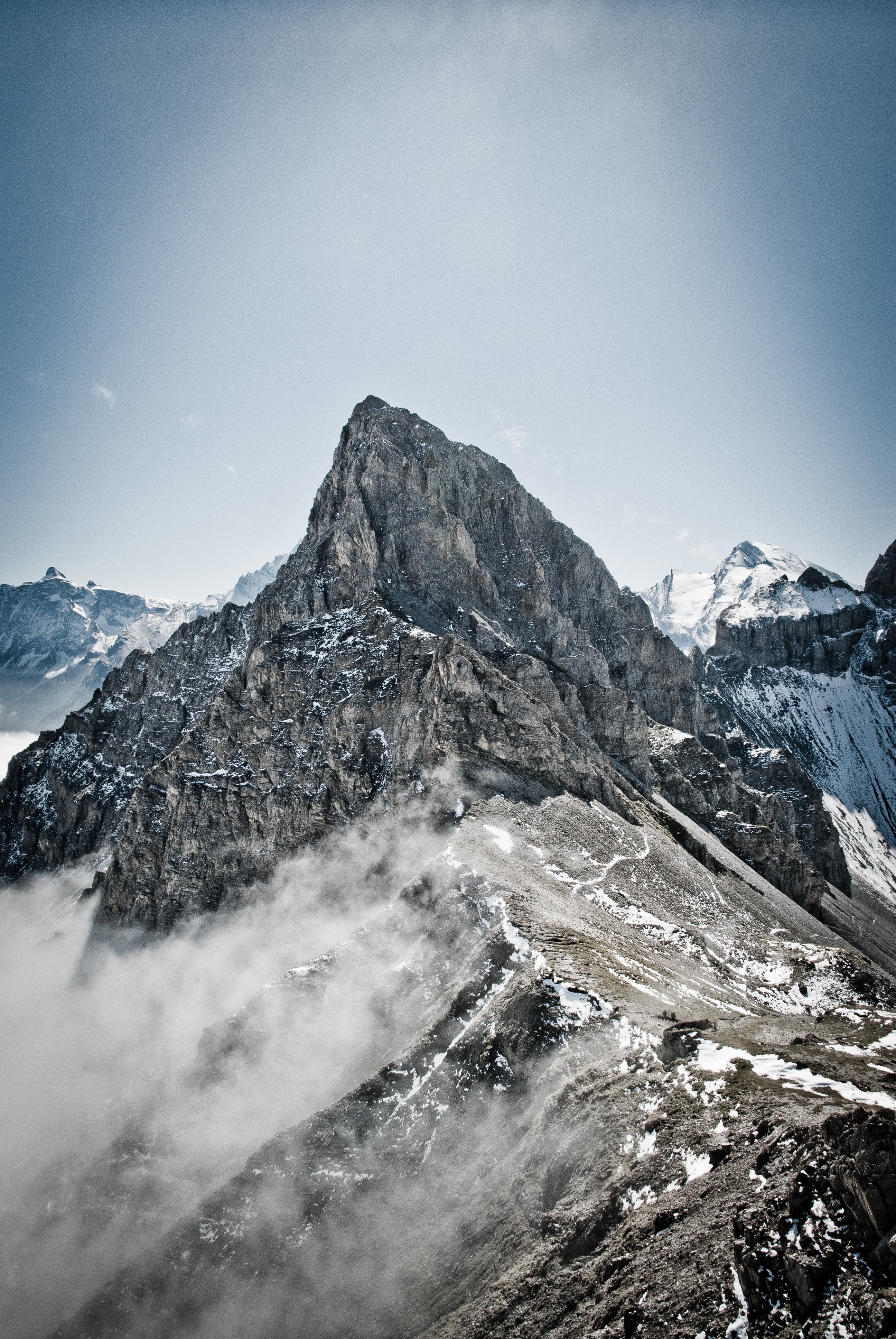 misty fog wraps around snowy mountain at bunderspitz, fog on bunderspitz mountain 4k, Phone HD Wallpaper