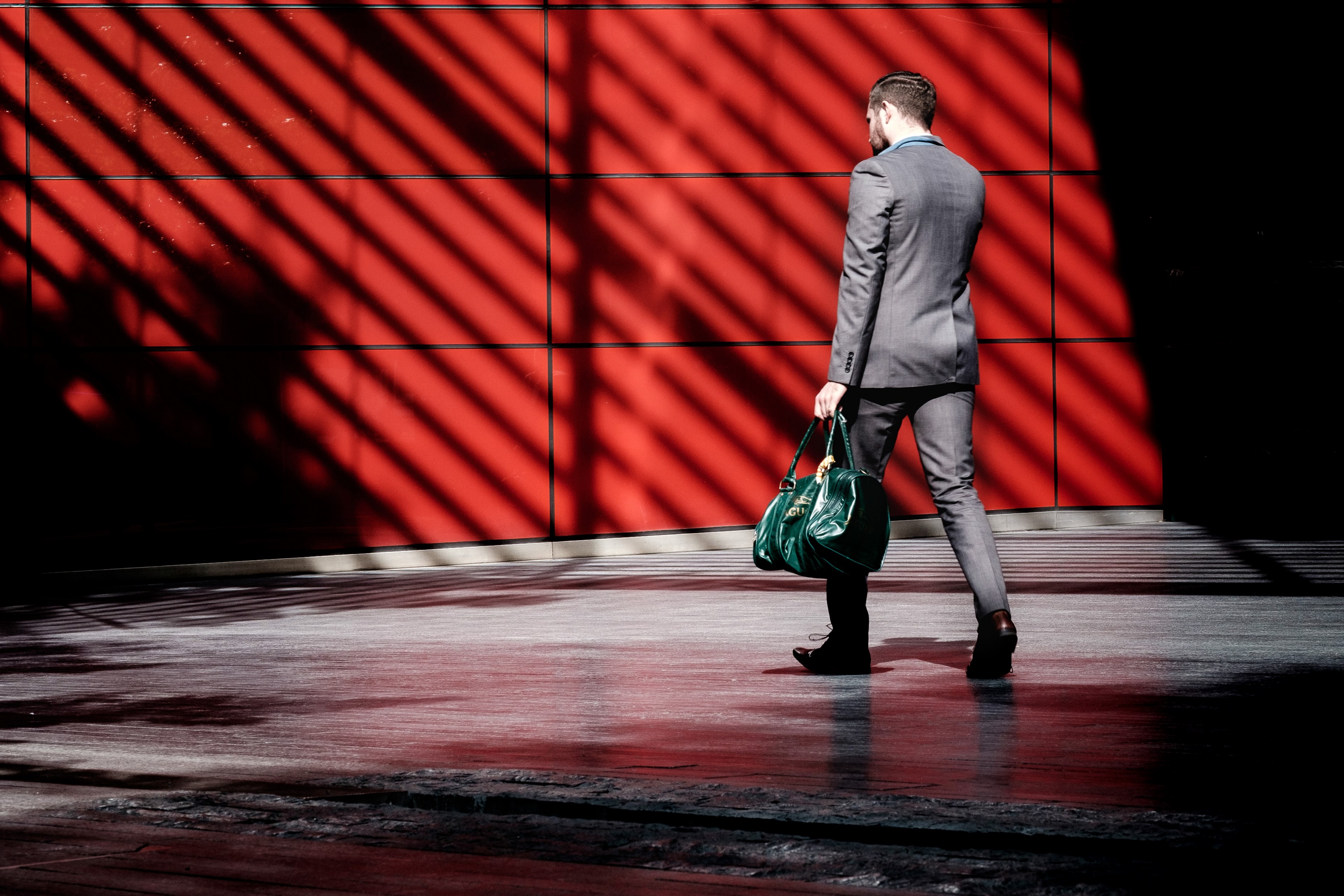 a professionally dressed male carrying a green bag, _the red stripes and the man in a suit 4k, HD Wallpaper