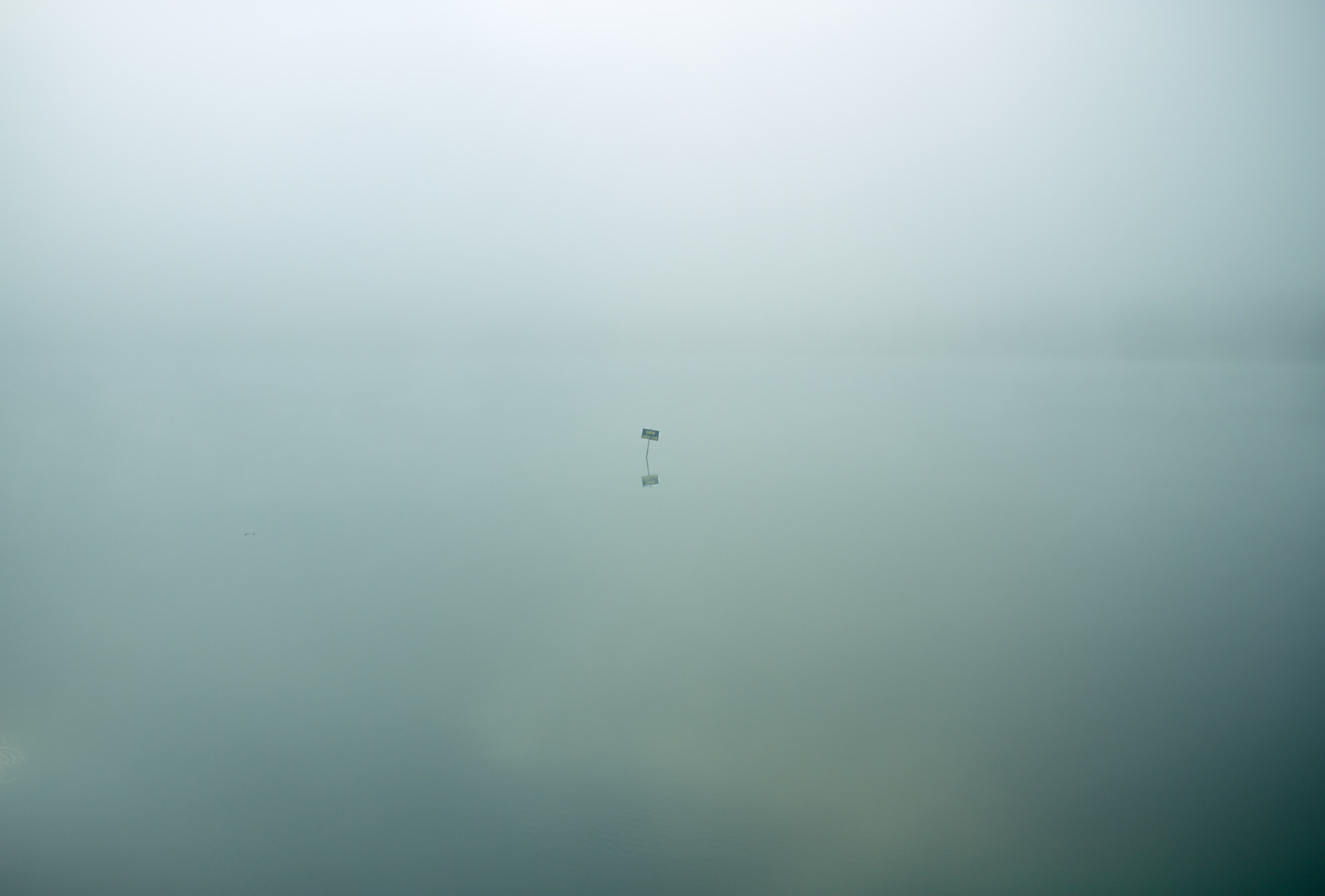 single isolated sign sits in eerie still waters covered in clouds, eerie isolation 4k, HD Wallpaper