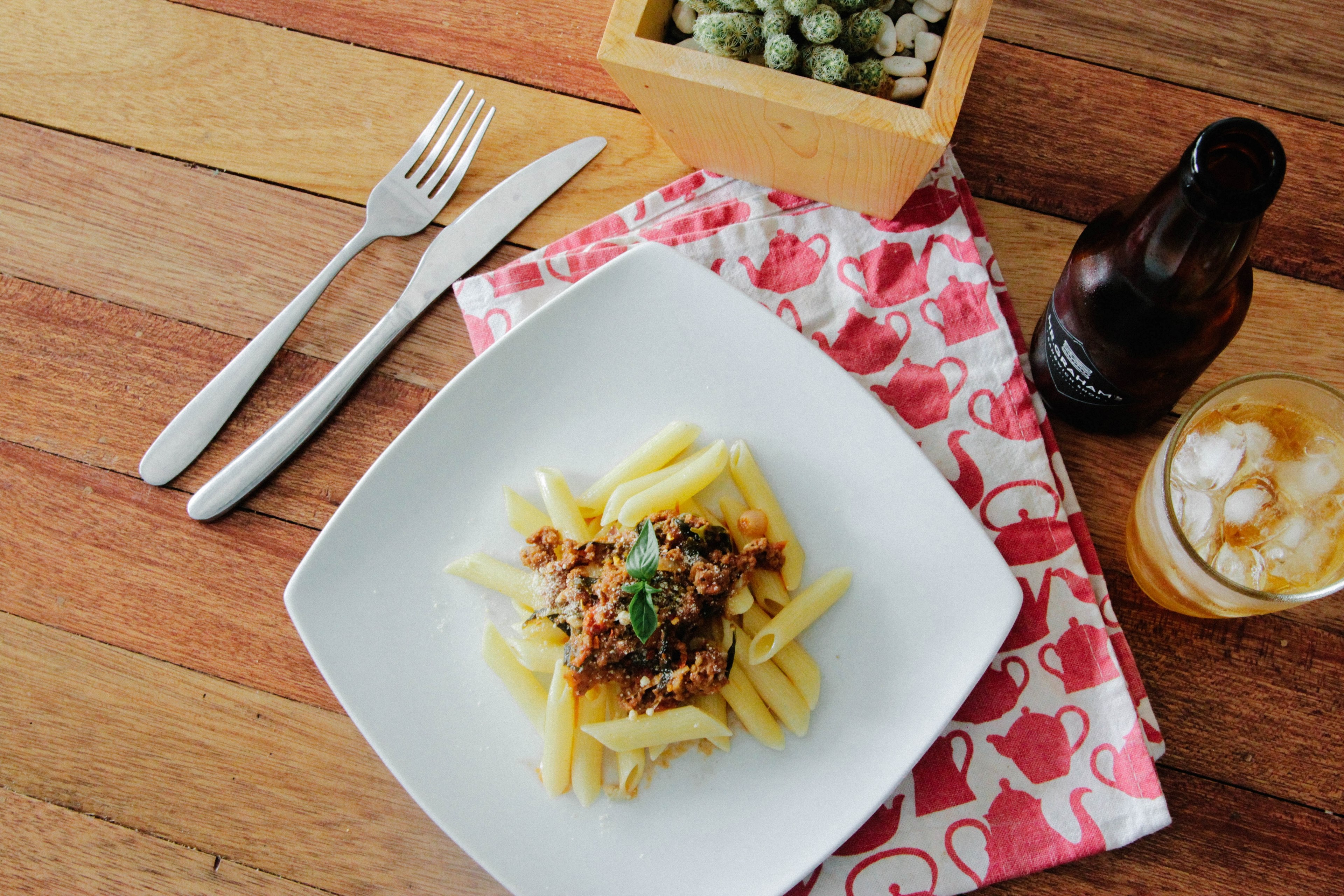 an aerial view of food in a white plate with cutlery and beer by its side in makati, _food cutlery and beer 4k, HD Wallpaper