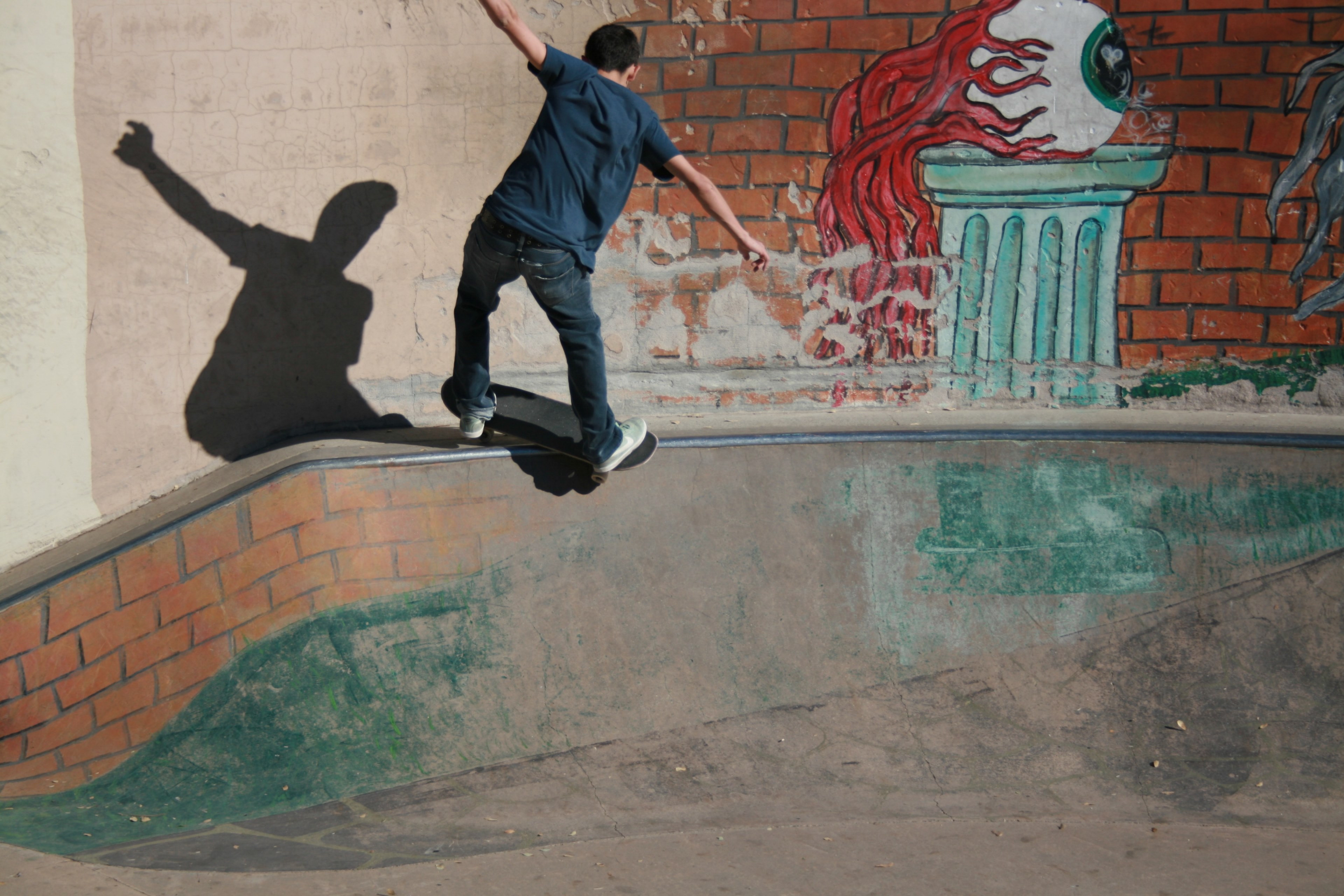 skateboarder grinding on small ramp near eyeball graffiti at american river canyon overlook park, skateboarder in front of street art 4k, HD Wallpaper