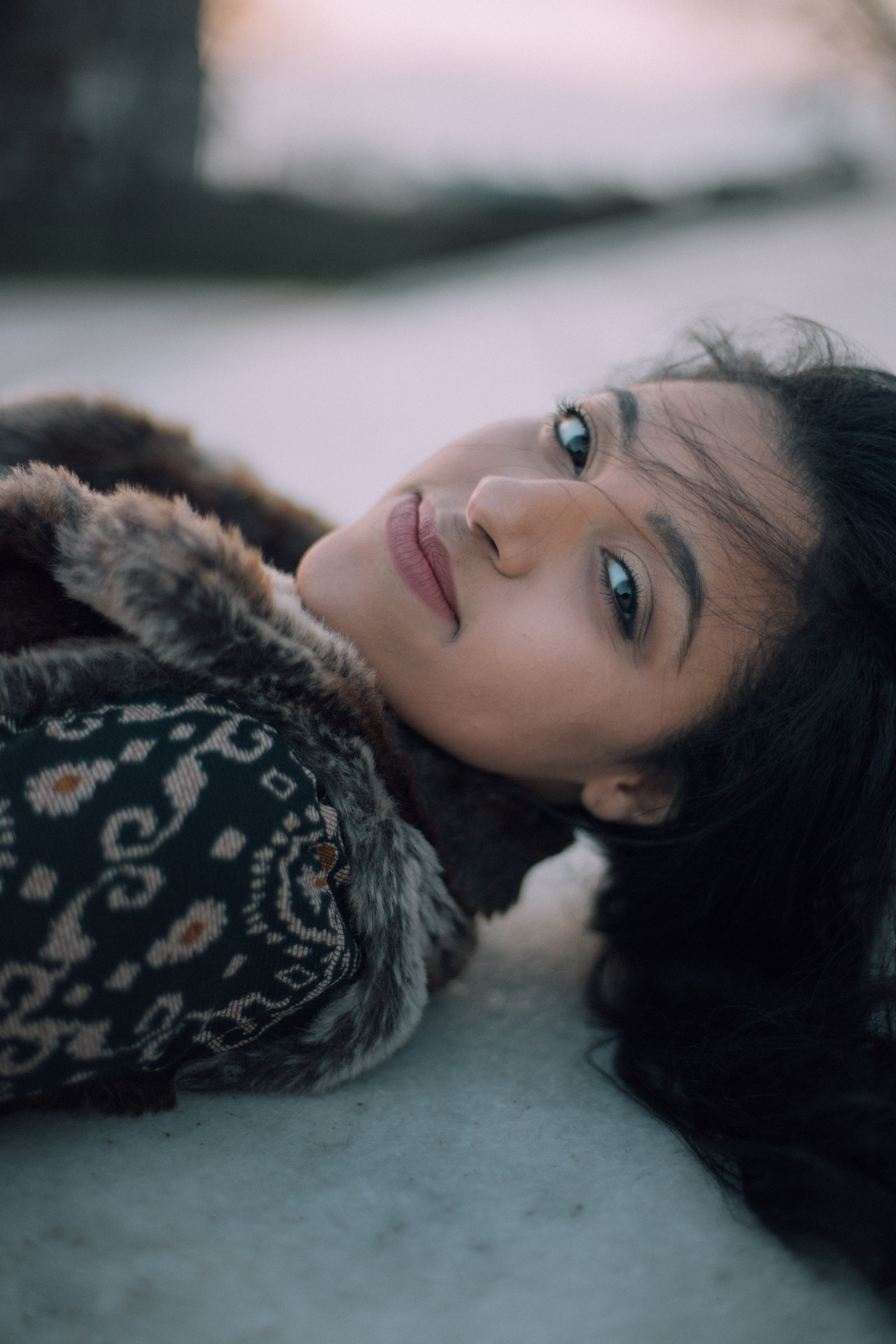 happy young woman lies down on a windy day, woman lying on concrete 4k, Phone HD Wallpaper