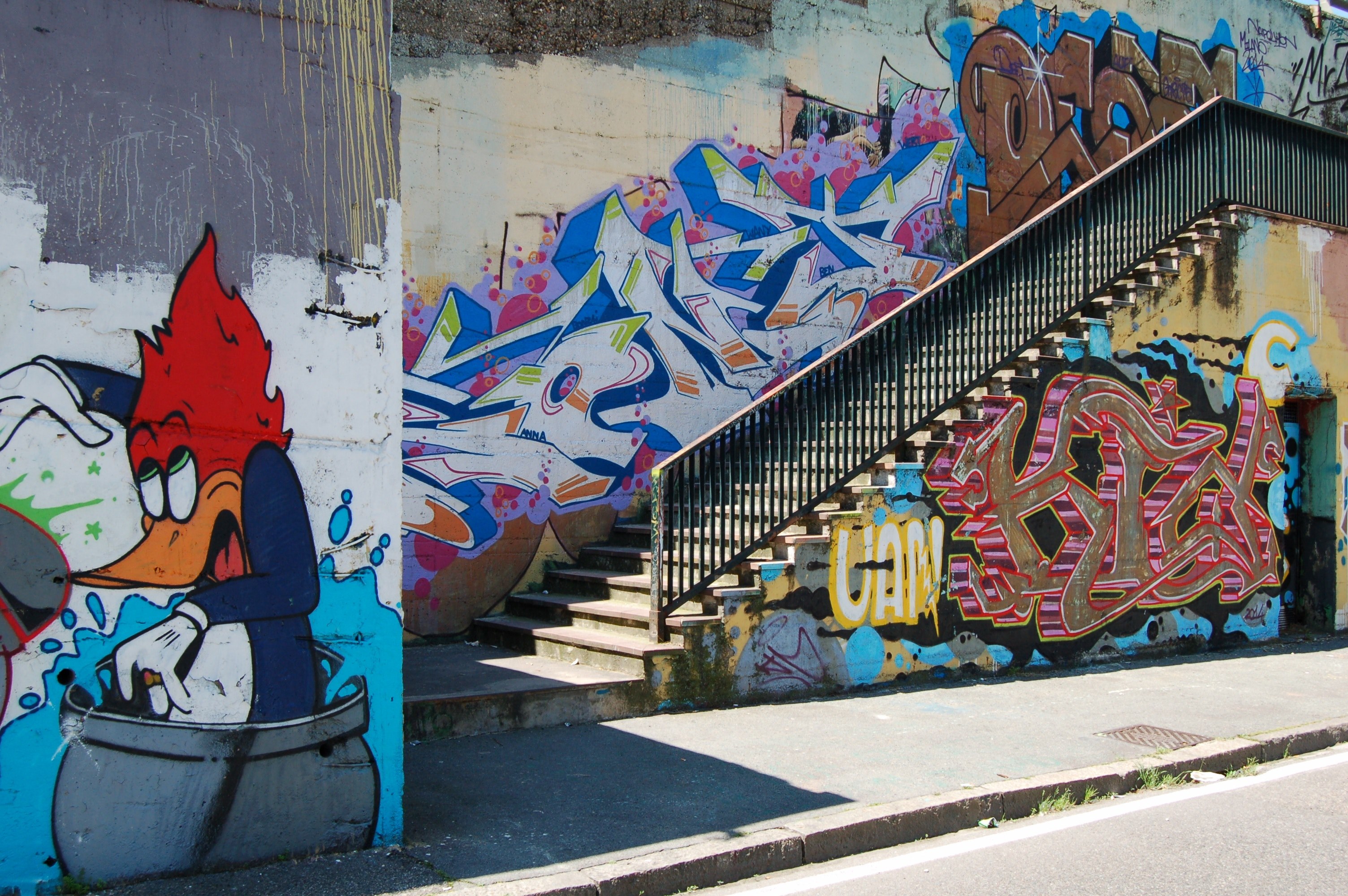 urban stairwell and railing with colorful graffiti covered wall and duck street at, graffiti on a sunny day 4k, HD Wallpaper