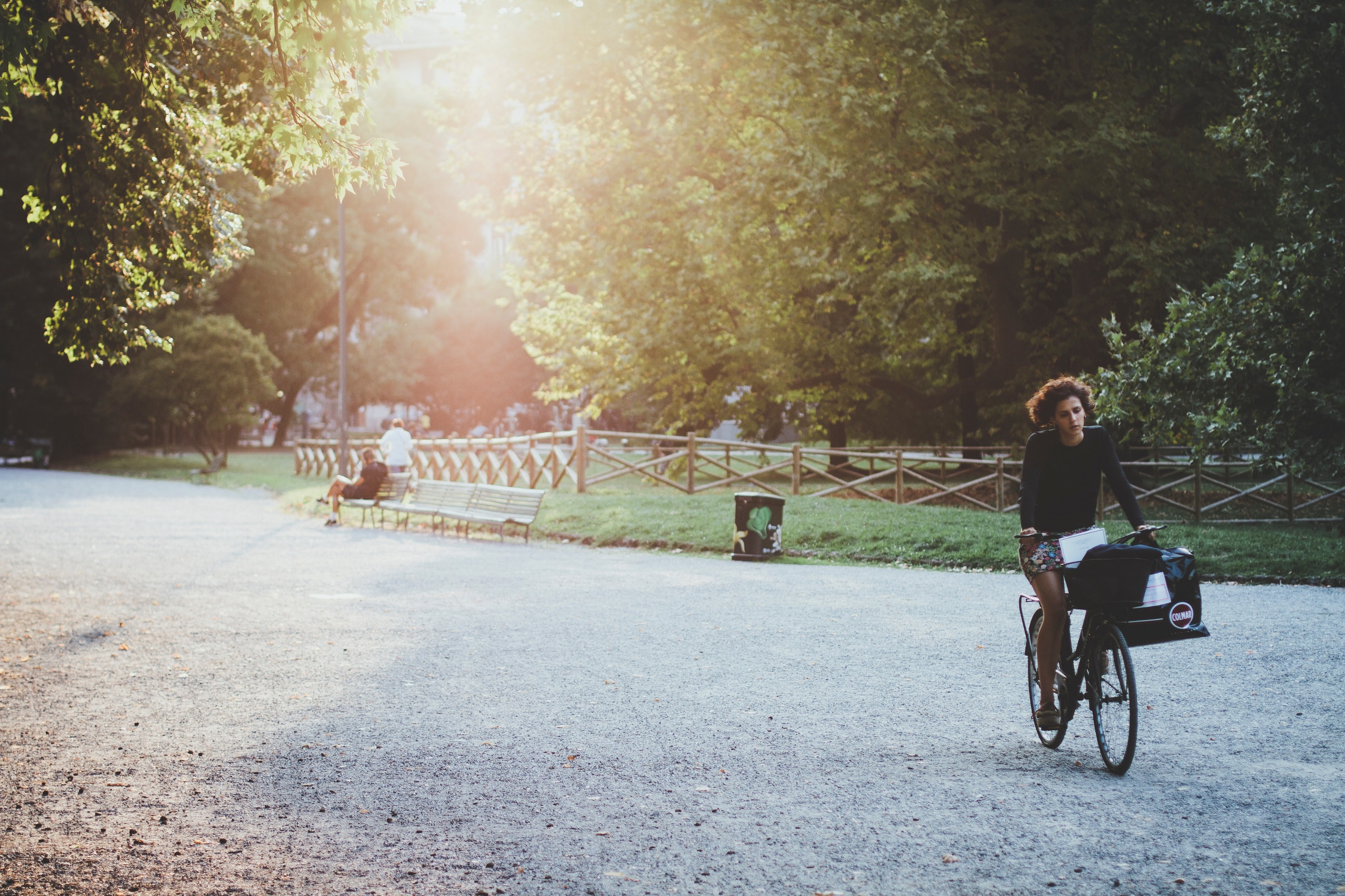 a woman riding a bicycle in a park lane on a sunny evening, riding a bike in the park 4k, HD Wallpaper