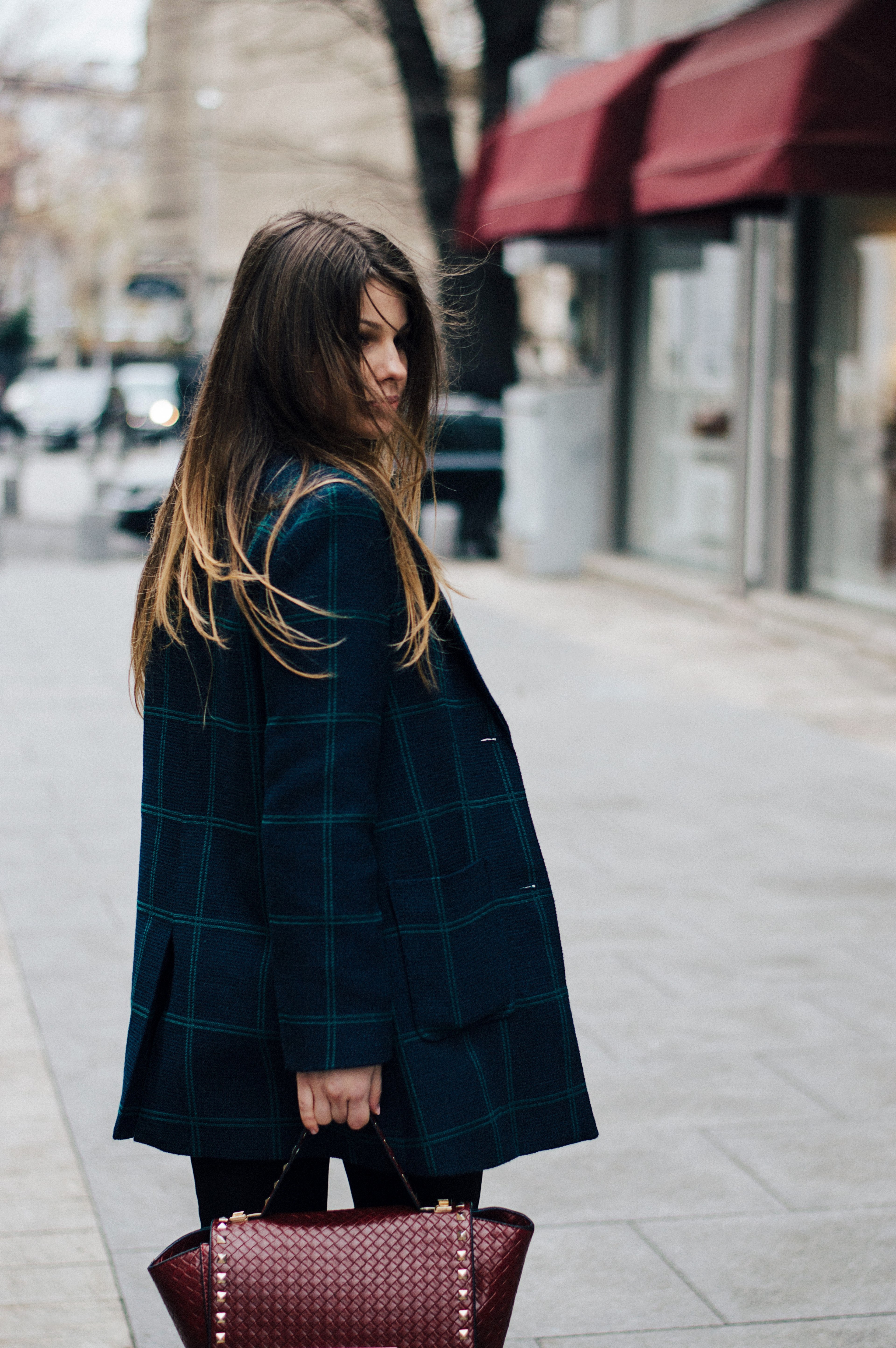 a woman wearing a plaid jacket and red handbag on the street in bucharest, lost in the city 4k, Phone HD Wallpaper