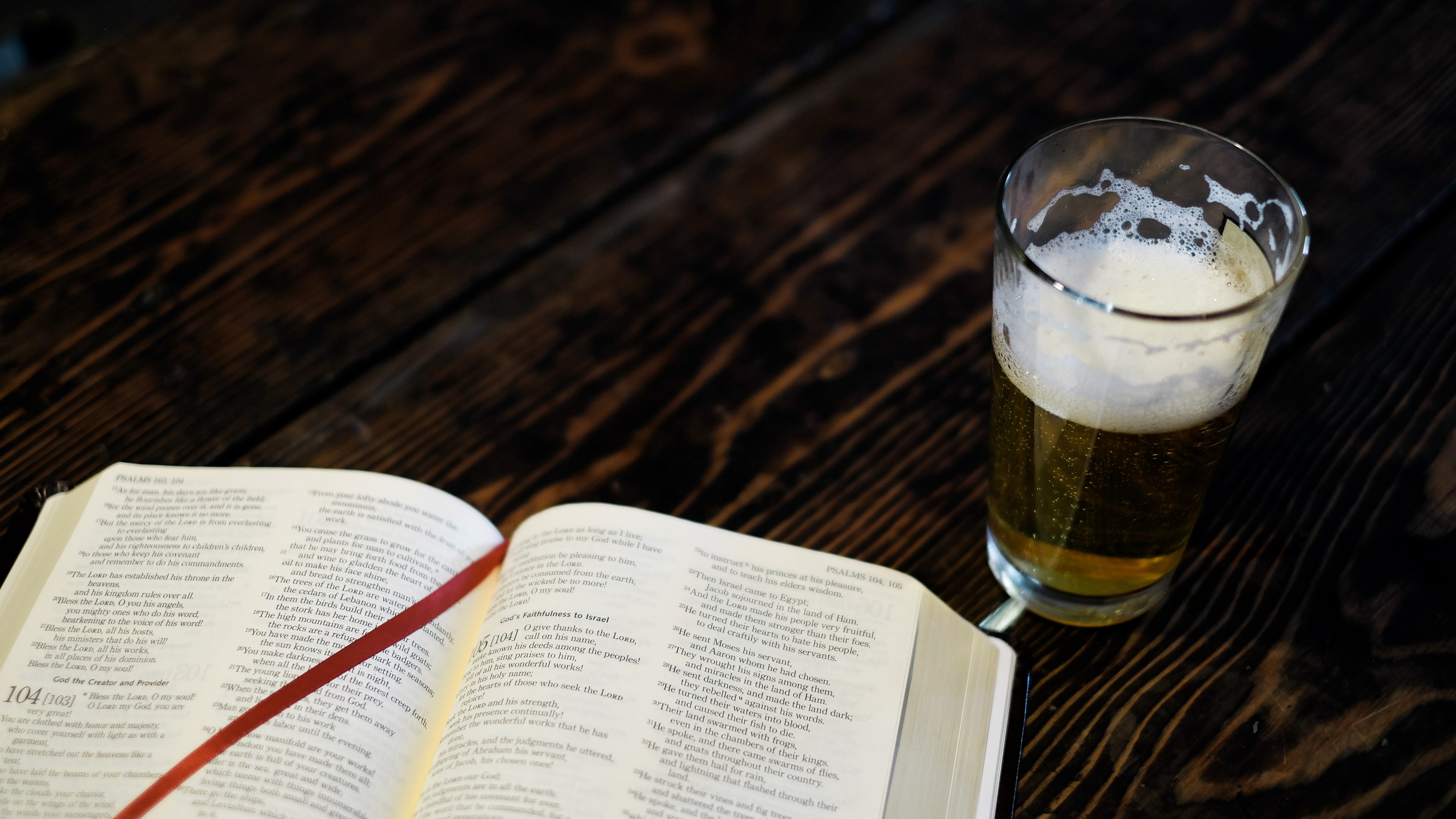 a large hardcover book next to a glass of beer, _bible beer 4k, HD Wallpaper