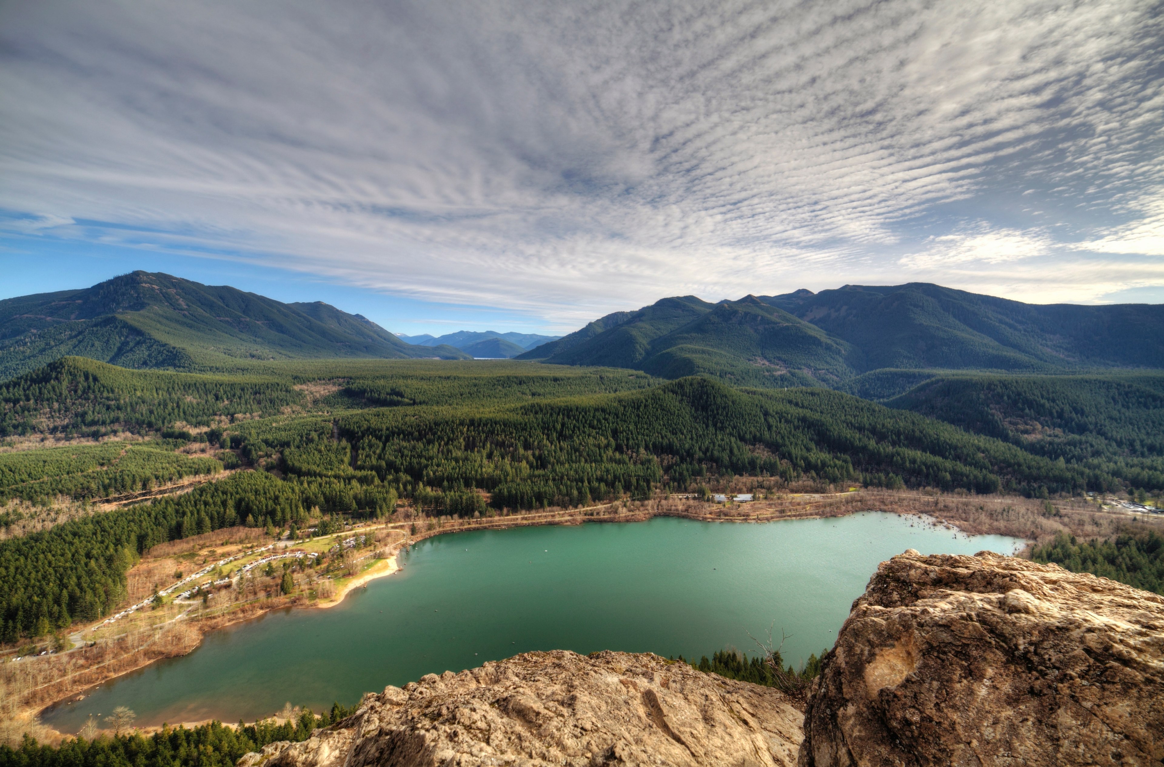 a small lake surrounded by wooded hills and jagged rocks, desolate lake 4k, HD Wallpaper