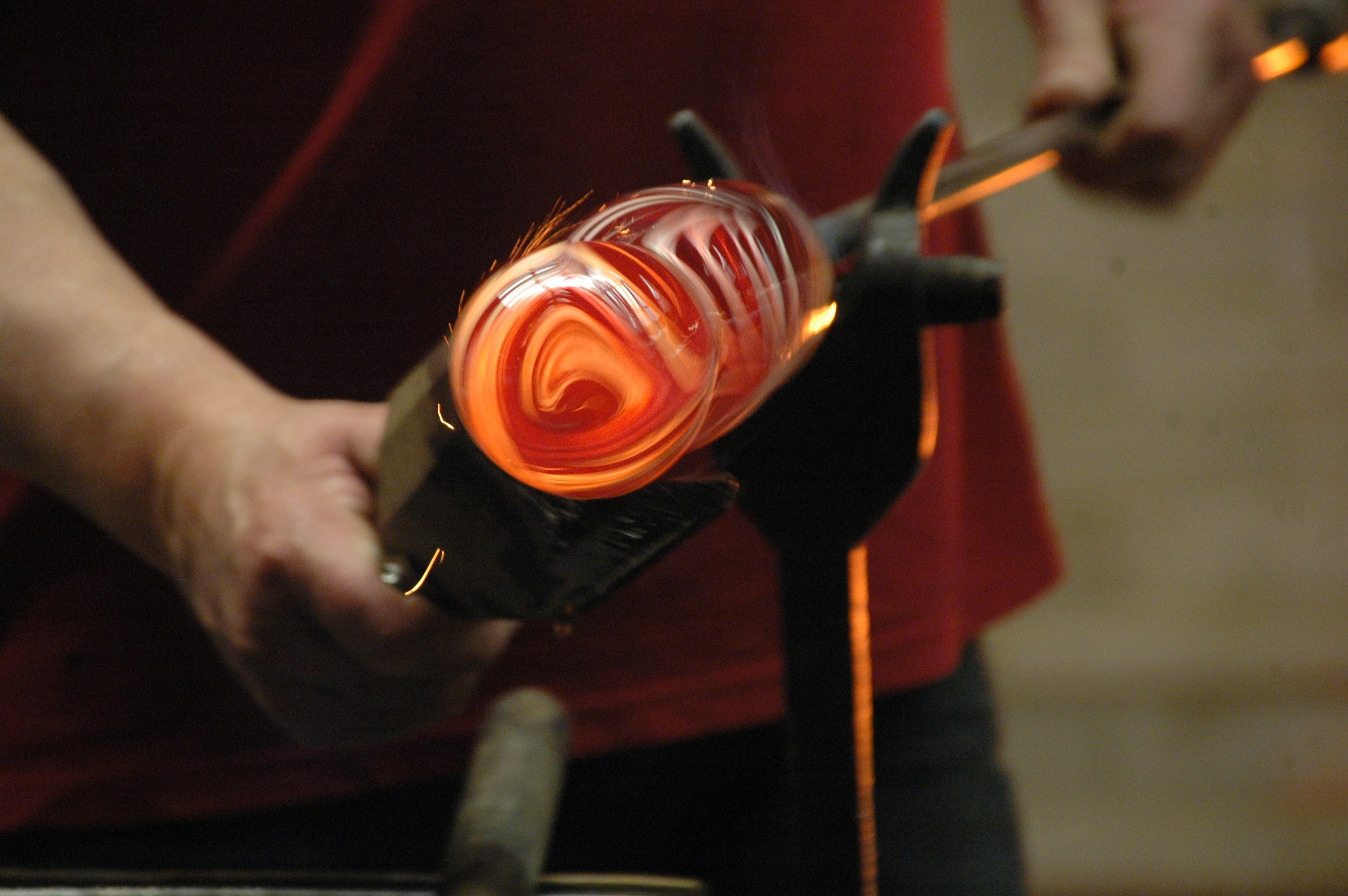 a person shaping amber colored glass, glassblower at work 4k, HD Wallpaper