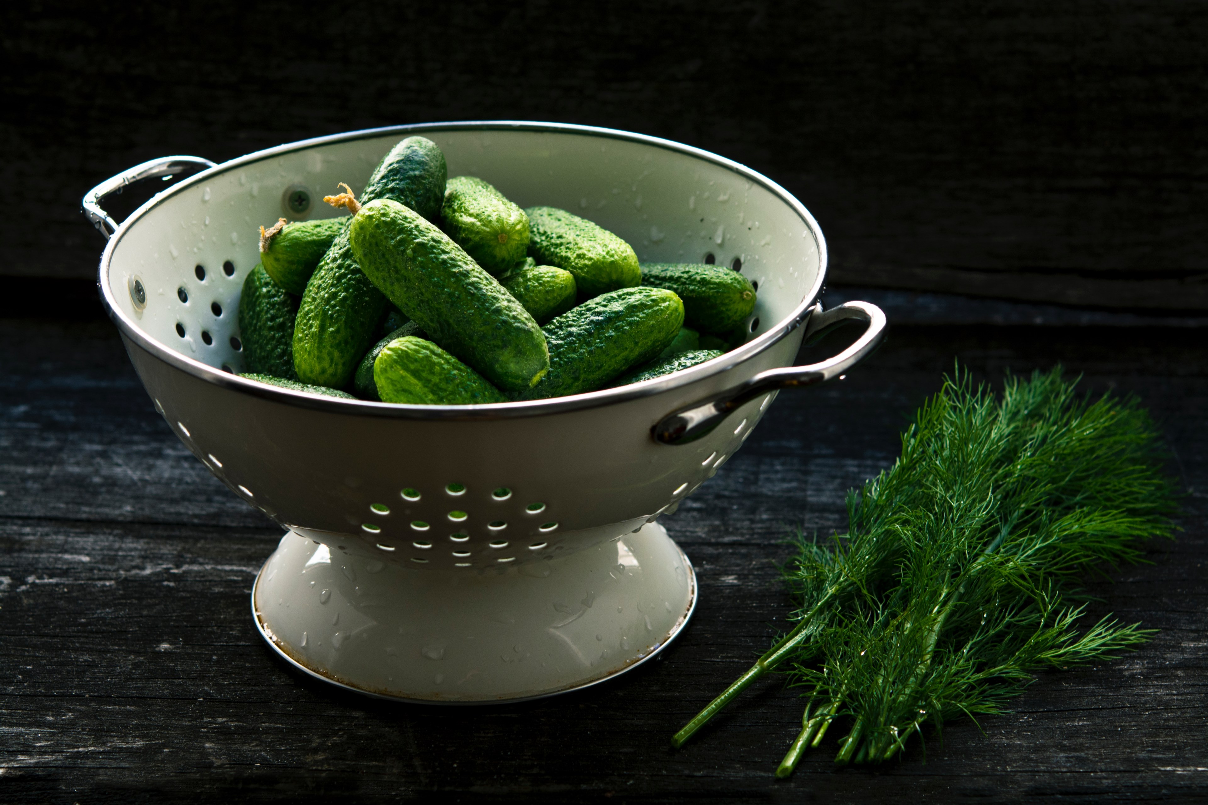 colander with fresh cucumbers on a table next to dill and herbs, pickle ingredients 4k, HD Wallpaper