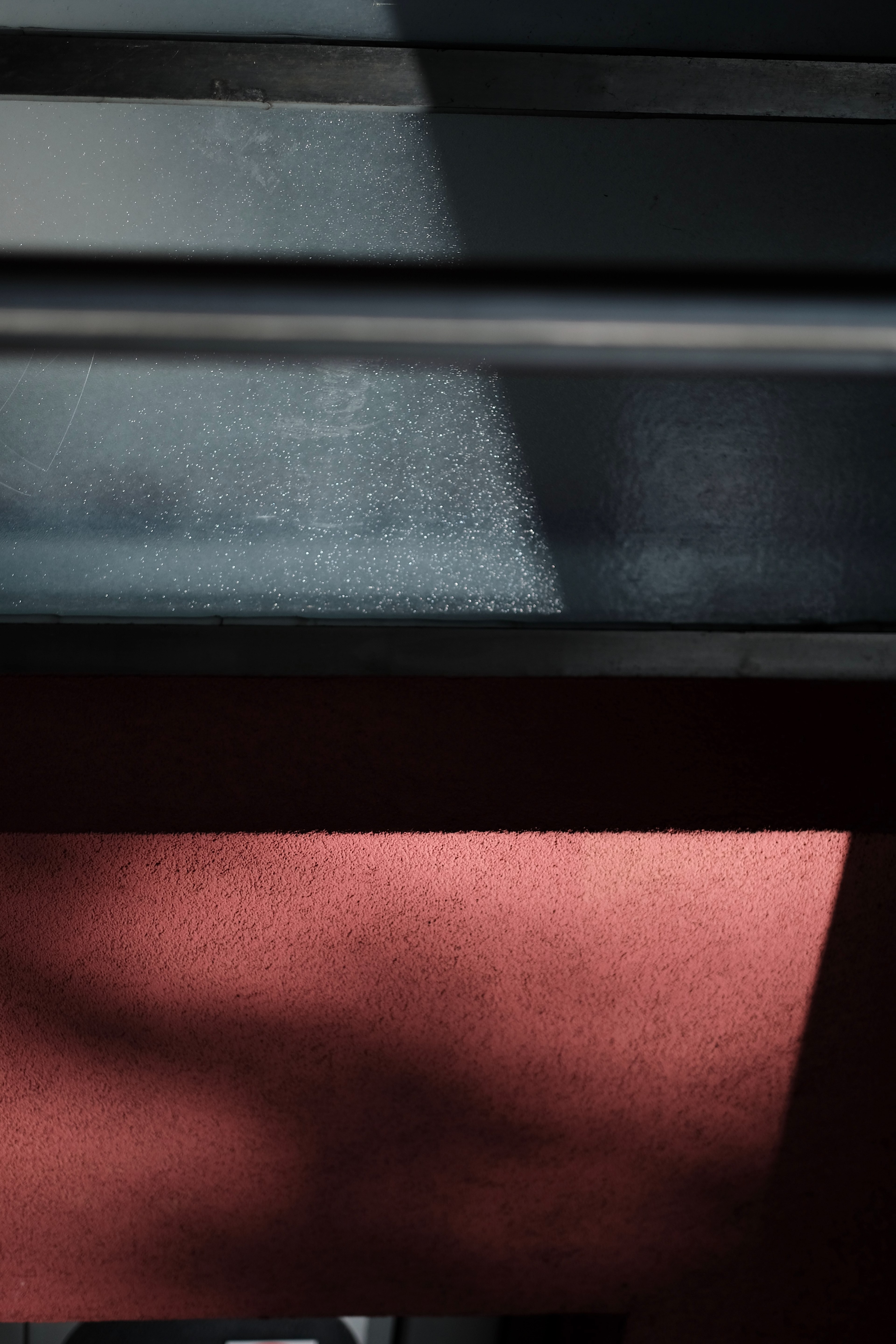 sunlight on a black steel surface above a rough red wall, sunlight on black and red 4k, Phone HD Wallpaper