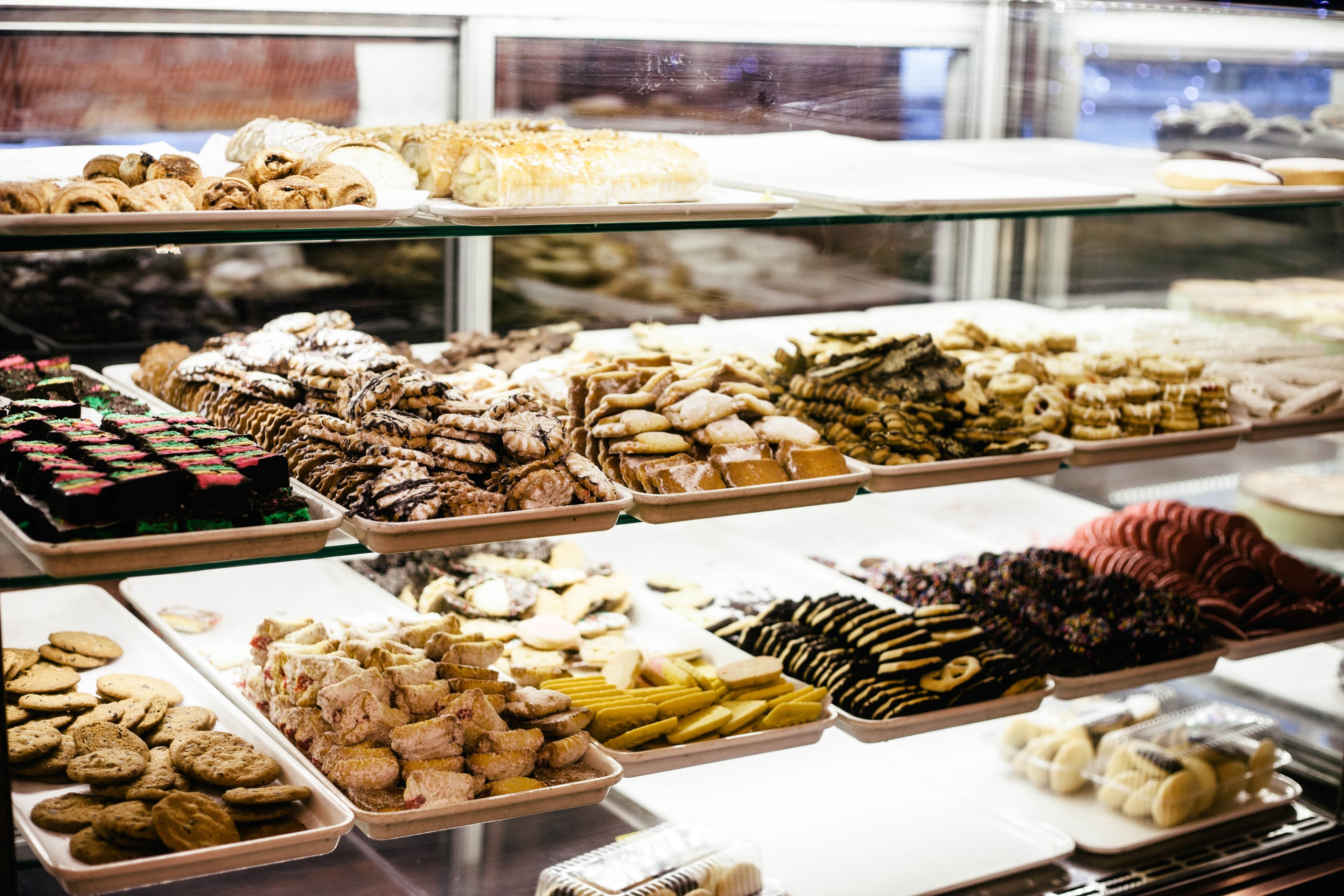 trays full of various cookies and pastries in a confectionery, trays of baked goods 4k, HD Wallpaper
