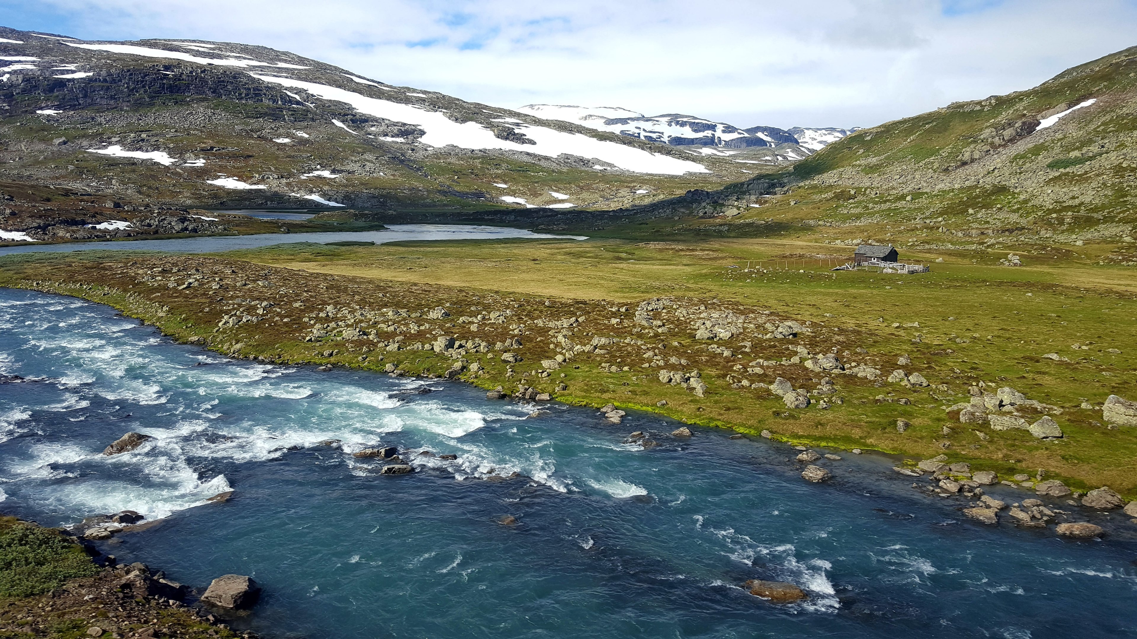 view of the flowing river and rolling hills on a cloudy day at myrdal, river and hills myrdal 4k, HD Wallpaper