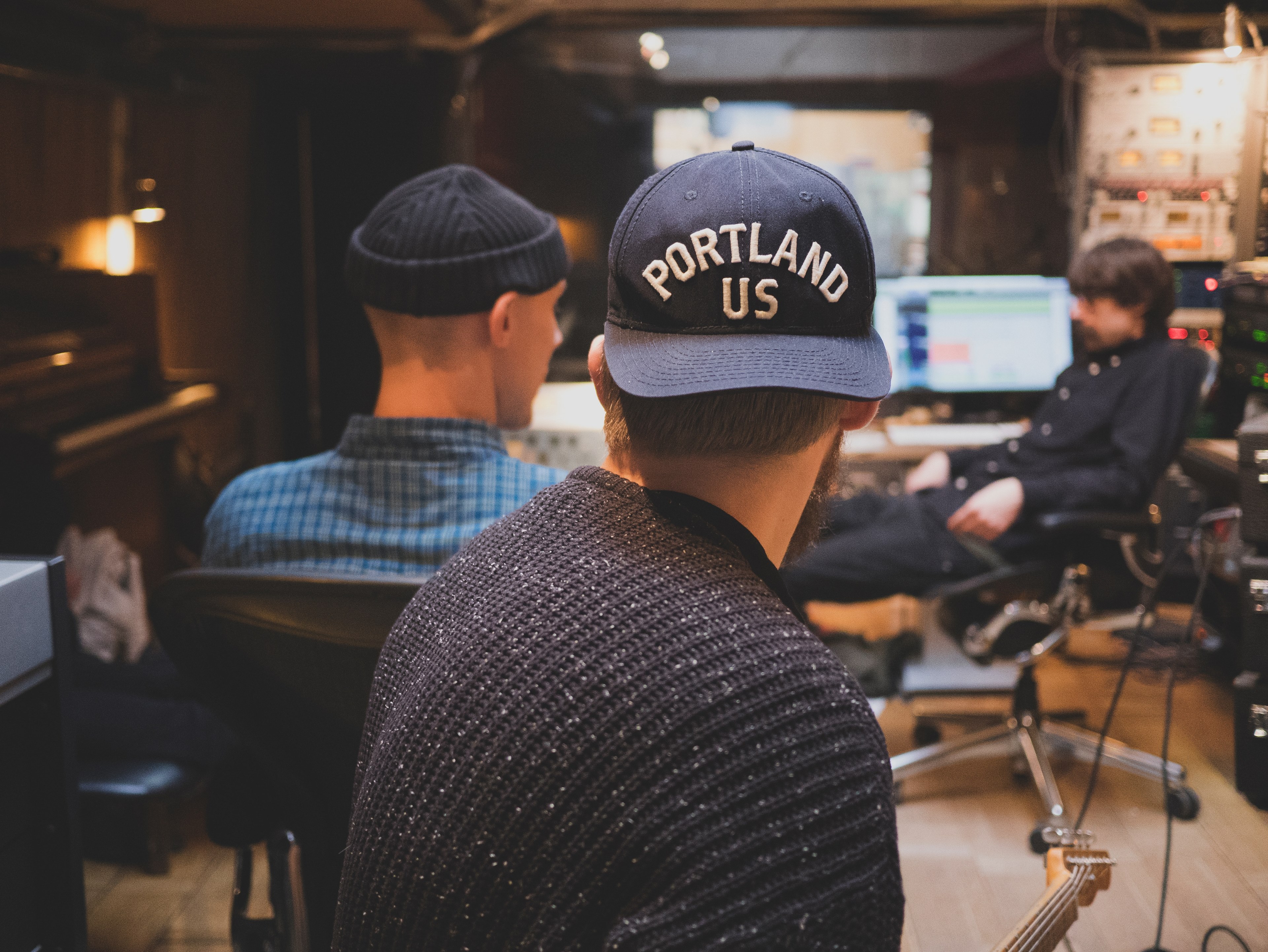 three male musicians sitting in a recording studio in gothenburg, band in a studio 4k, HD Wallpaper