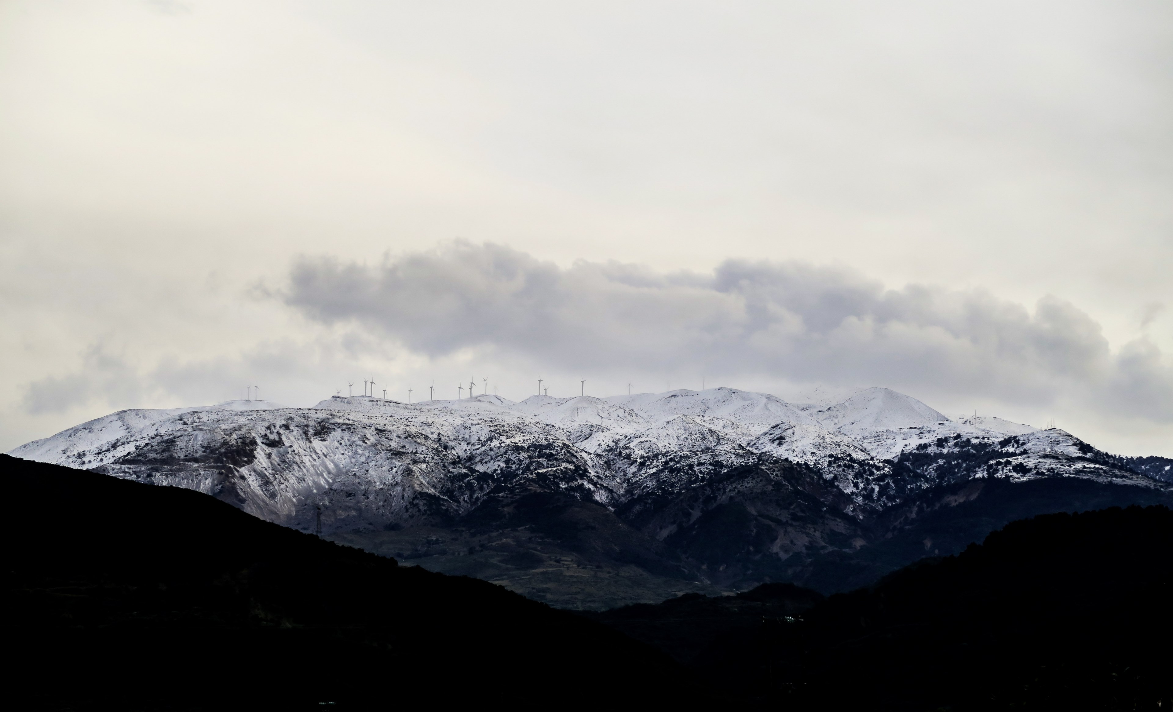 a wind farm on snow topped mountains in drepano, wind farm in the mountains 4k, HD Wallpaper