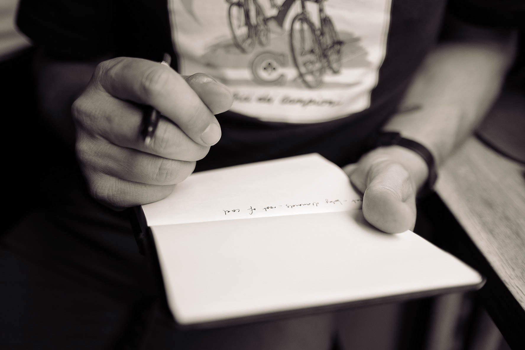 a desaturated shot of a person writing on a blank page, filling a blank page 4k, HD Wallpaper