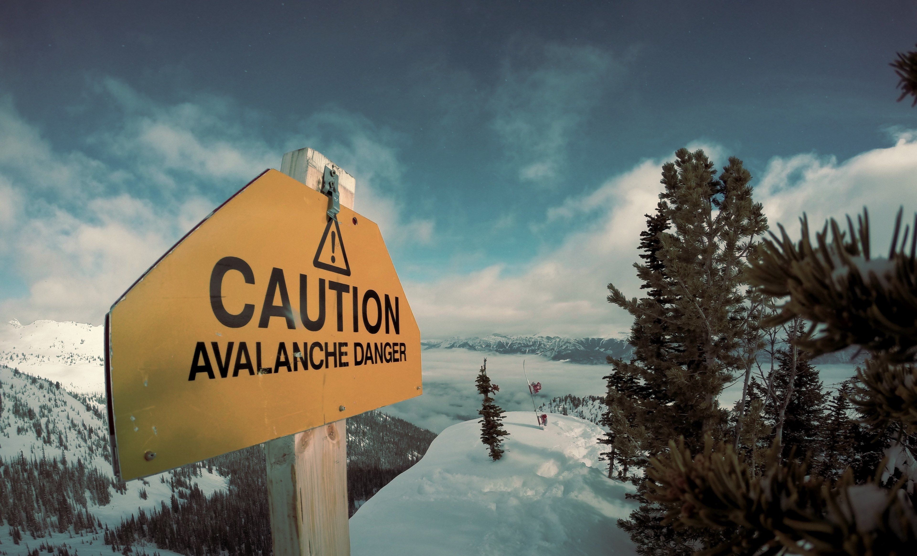 a yellow sign high in the mountains reads caution avalanche danger, avalanche danger sign 4k, HD Wallpaper